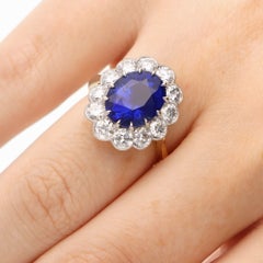 Contemporary Certified 7.09ct Oval Sapphire and Diamond Cluster Ring