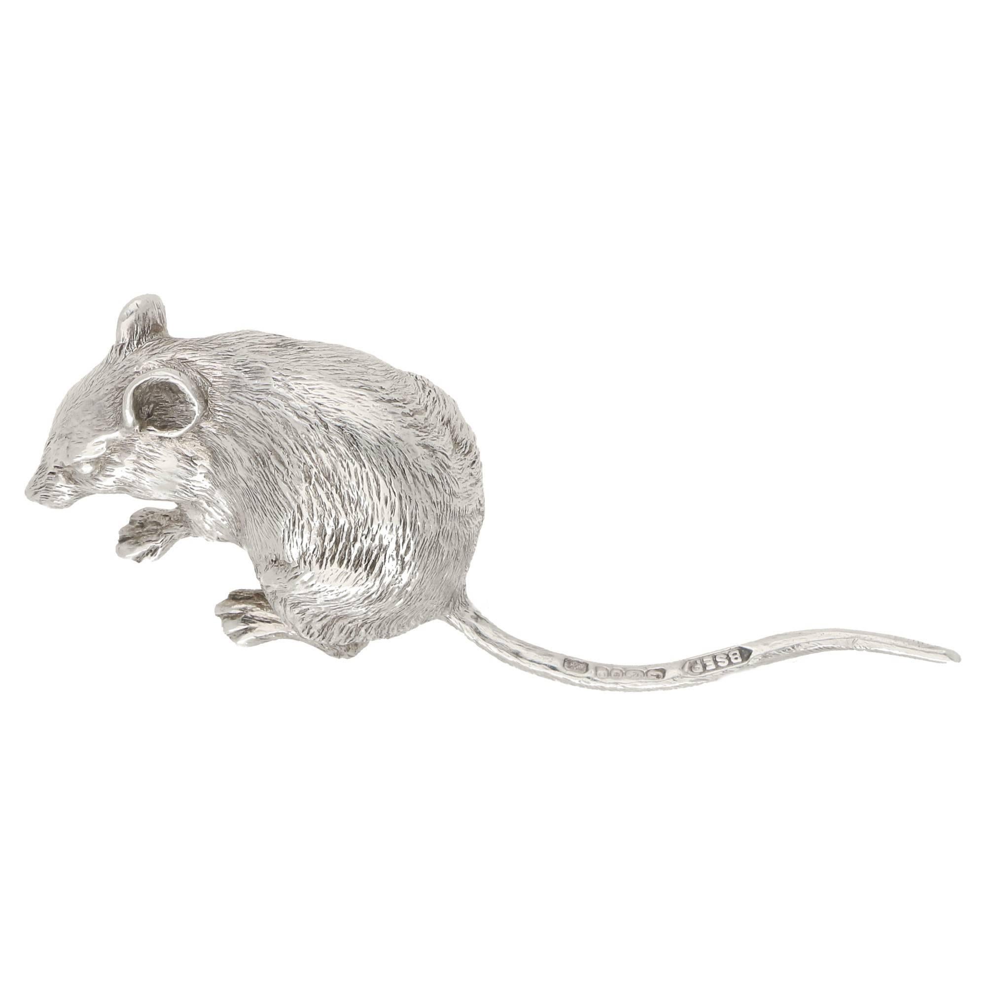 A contemporary silver mouse model, in 925 sterling silver, made by BSEP London. This beautifully detailed figure of a little mouse is made of Solid Silver and is very weighty for its miniature size. It measures 80mm length, 20mm width, 15mm height.