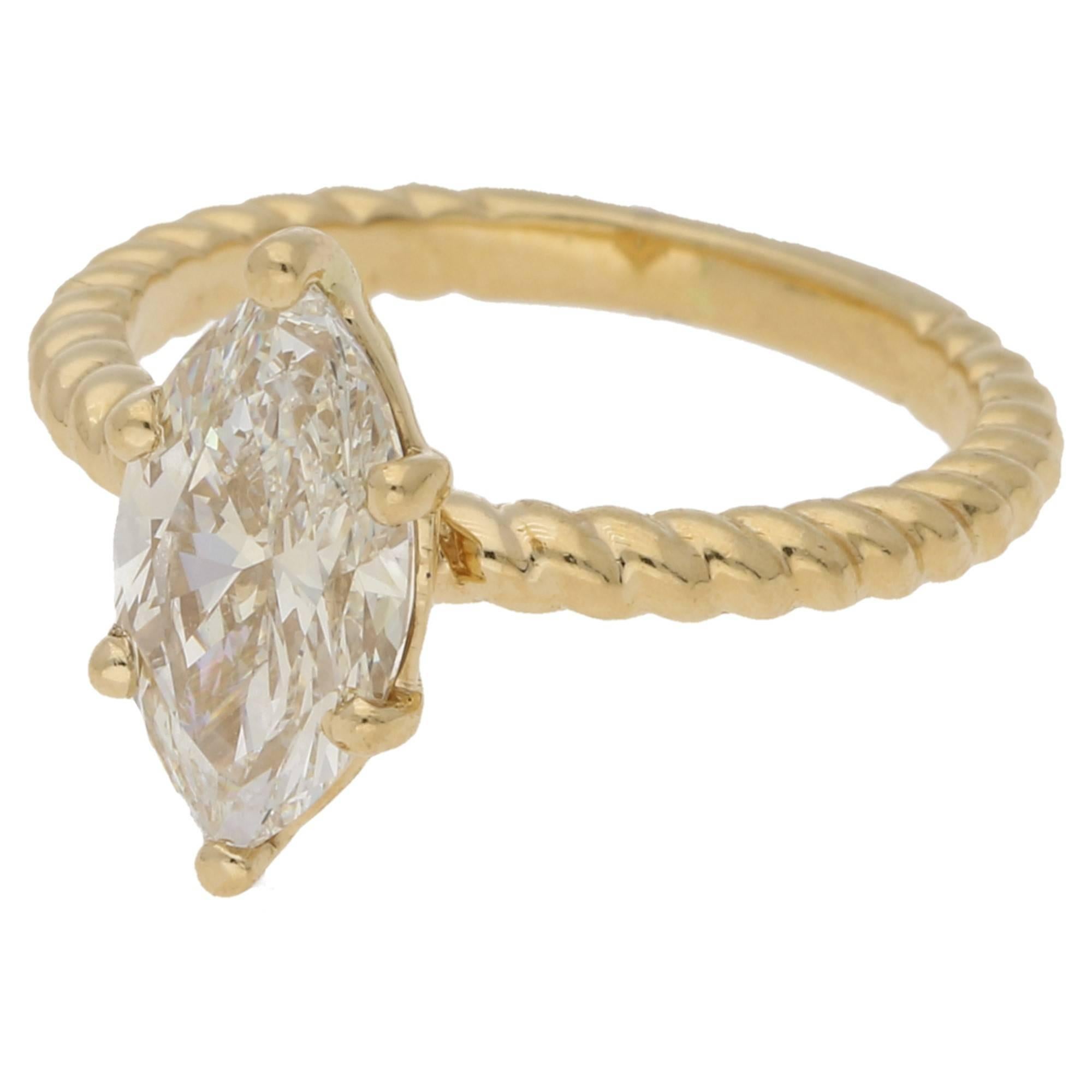 A beautiful, quirky and one-off ring featuring a marquise cut diamond, independently certified as 1.60ct JVVS2 set in a six claw double gallery setting to a rope twist shank in 18ct yellow gold. The ring is finger size J 1/2 but can be sized to