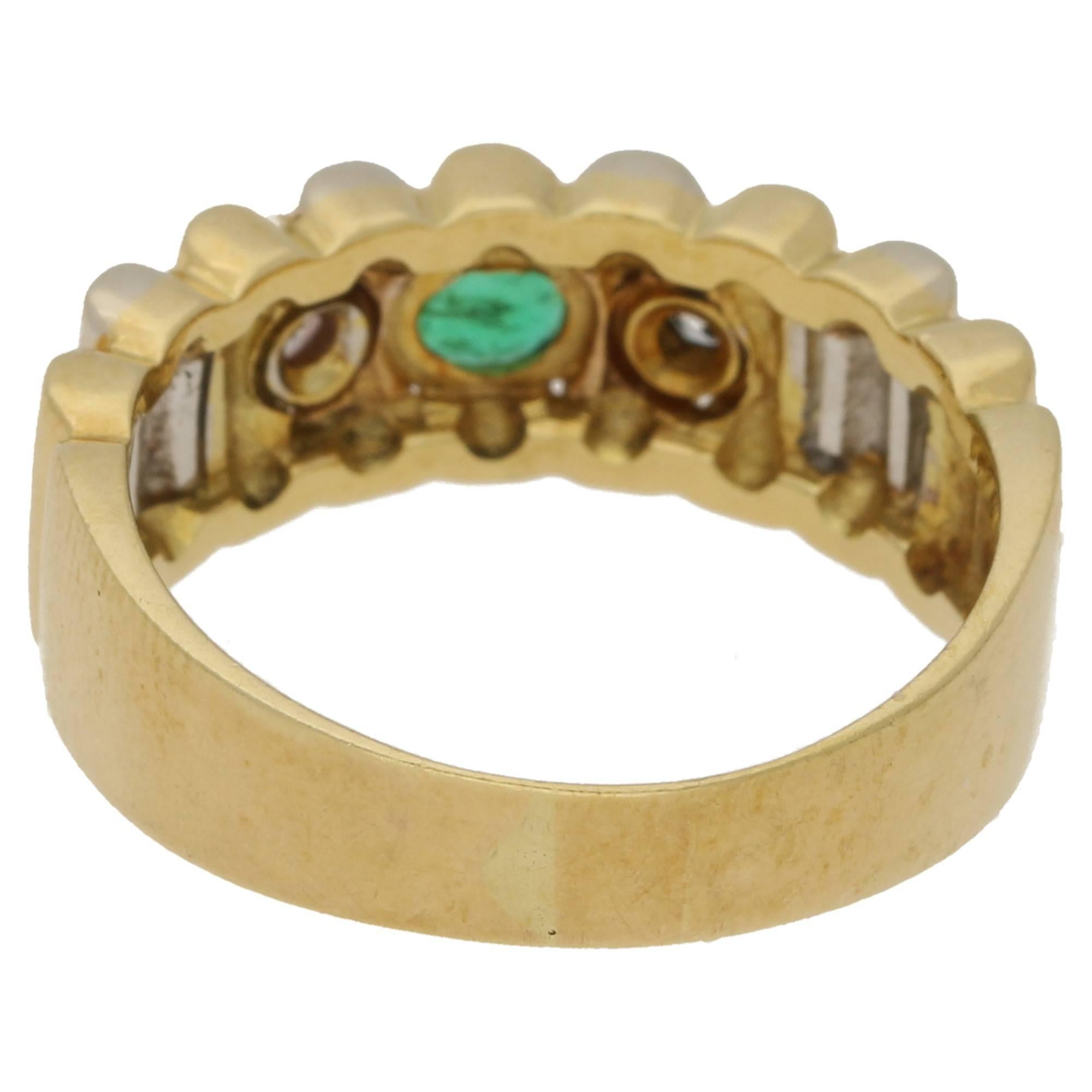 A really tactile piece, with it's undulating top face. The ring is made from 18k gold, the front face is in alternating tones of white and yellow gold. This is then set with two round brilliant diamonds and a central emerald which is a vibrant green