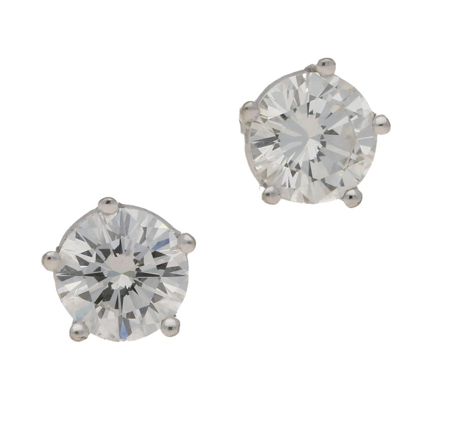 A stunning pair of diamond ear-studs set in 18ct white gold.  Each round brilliant cut diamond is set in four claw 18ct white gold. Estimated total diamond weight 1.70cts. Assessed diamond colour: H. Assessed diamond clarity: VVS2