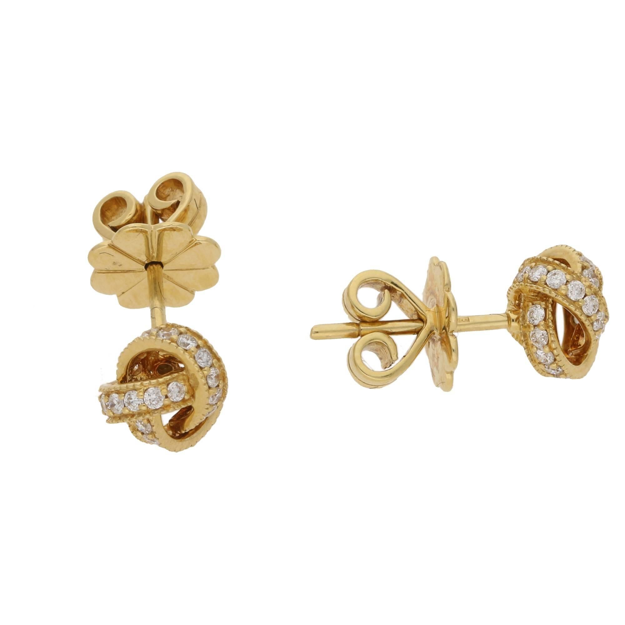 Classic 18ct yellow gold knot studs set with round brilliant cut diamonds set on a post with butterfly fittings.