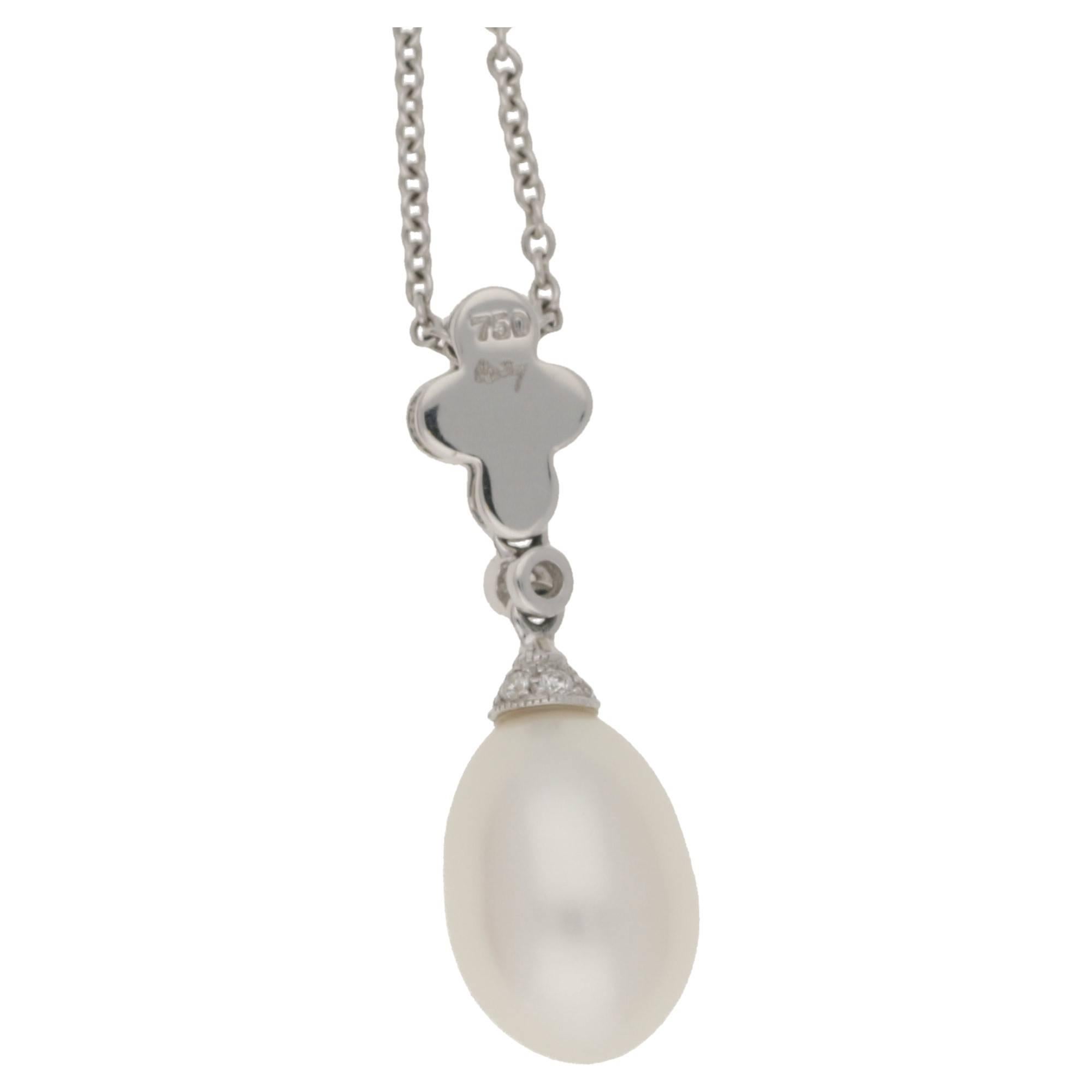 Pearl: 11.4mm. Estimated total diamond weight: 0.27cts. Assessed diamond colour: G-H. Assessed diamond clarity: VS1.
An 18ct white gold pearl and diamond drop pendant. 
The elongated oval pearl displays a beautiful orient and exceptional lustre