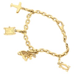 Cartier Bracelet breloque panthère vintage français en or jaune avec diamants et saphirs