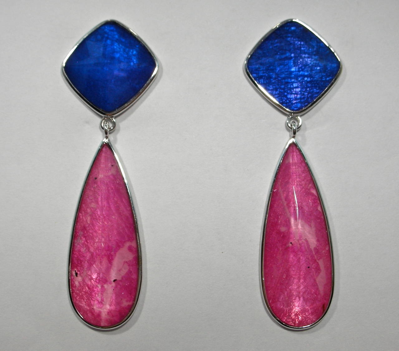 Jona design collection, hand crafted in Italy, 18 Karat white gold drop earrings set with a crazy cut Quartz over Blue Sapphire and Mother of Pearl, weighing 15.6 carats & 21.7 carats of , Quartz over Rubellite Tourmaline and Mother of Pearl. Clips