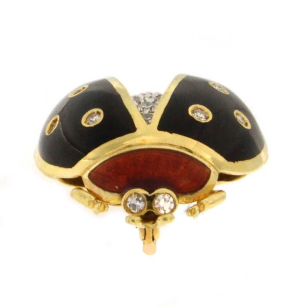 Jona design collection, 18 karat yellow gold ladybug shaped brooch, adorned with red and black enamel and set with a white diamond pavé.    

All Jona jewelry is new and has never been previously owned or worn.