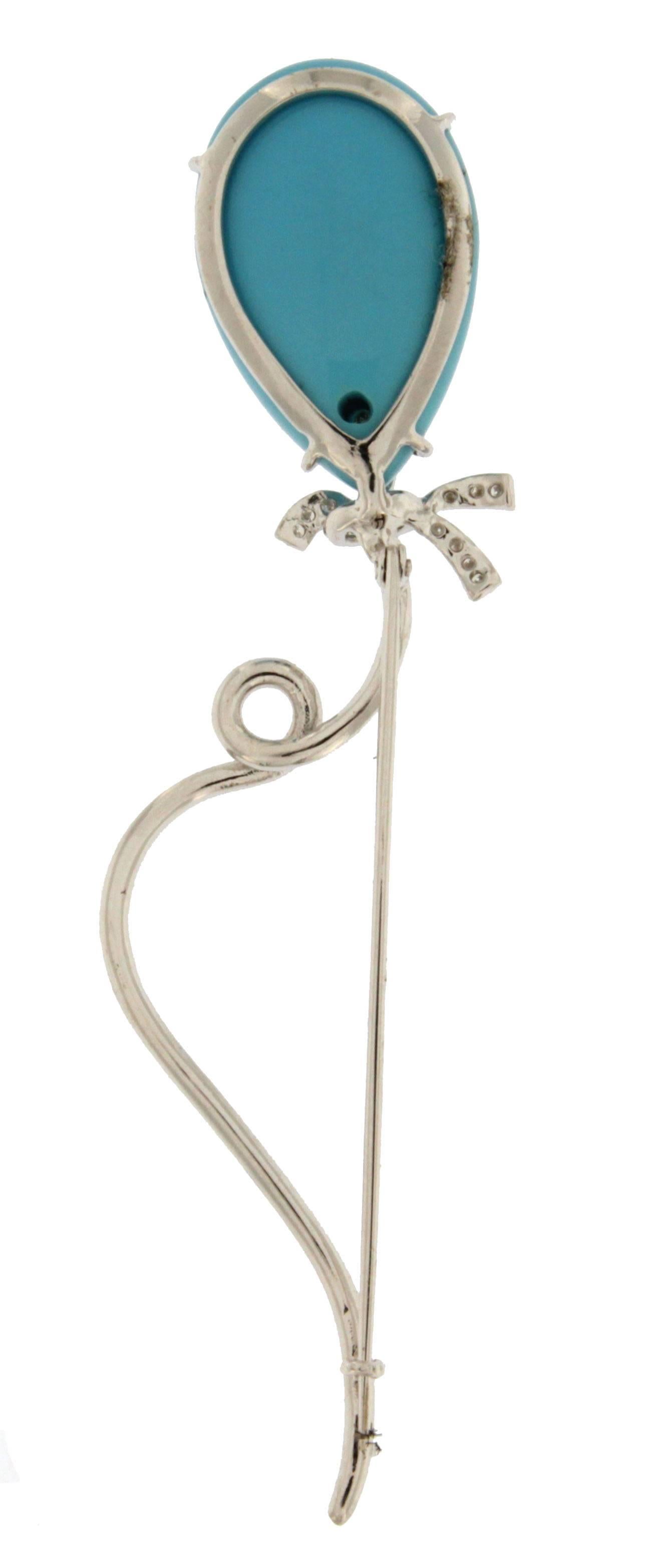 Jona one-of-a-kind design collection, hand crafted in Italy,18 karat white gold balloon brooch, featuring a cabochon turquoise weighing 15 carats and set with 0.34 carats of white diamonds.    

All Jona jewelry is new and has never been previously