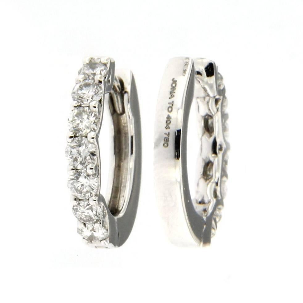 Jona design collection, hand crafted in Italy, 18 karat white gold hoop earrings set with 14 white diamonds weighing 0.56 carats, F color, VVS1 clarity. 
All Jona jewelry is new and has never been previously owned or worn. Each item will arrive at
