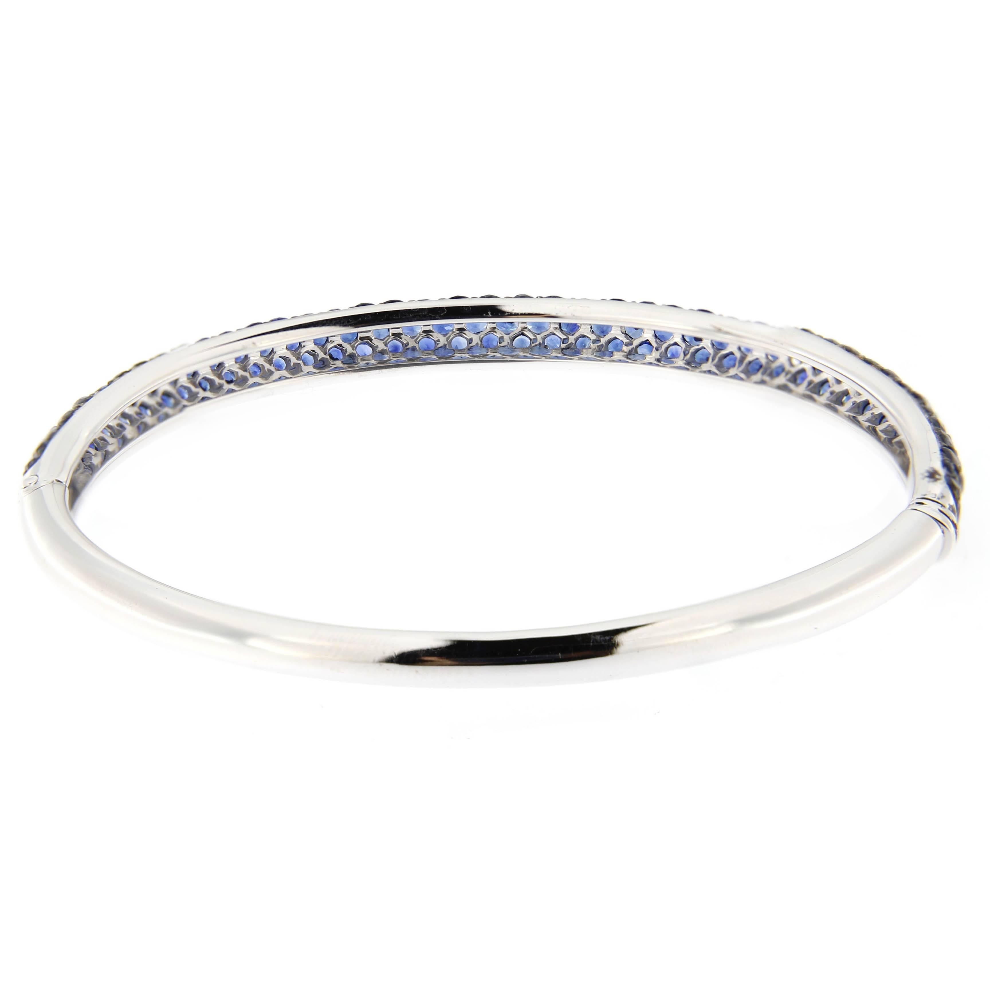 Jona design collection, hand crafted in Italy, 18 karat white gold bangle bracelet. The sapphire pavé is set with 103 burmese blue sapphires for a total weight of 5.34 carats.
All Jona jewelry is new and has never been previously owned or worn.