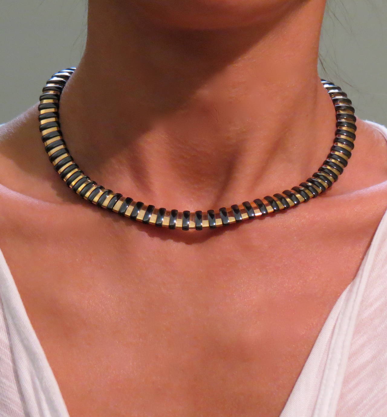 Jona design collection, hand crafted 18k rose gold and black high-tech
ceramic choker necklace.
With a hardness approaching that of diamond, high-tech ceramic is a highly
scratch-resistant material. Light and biocompatible, it is extremely
