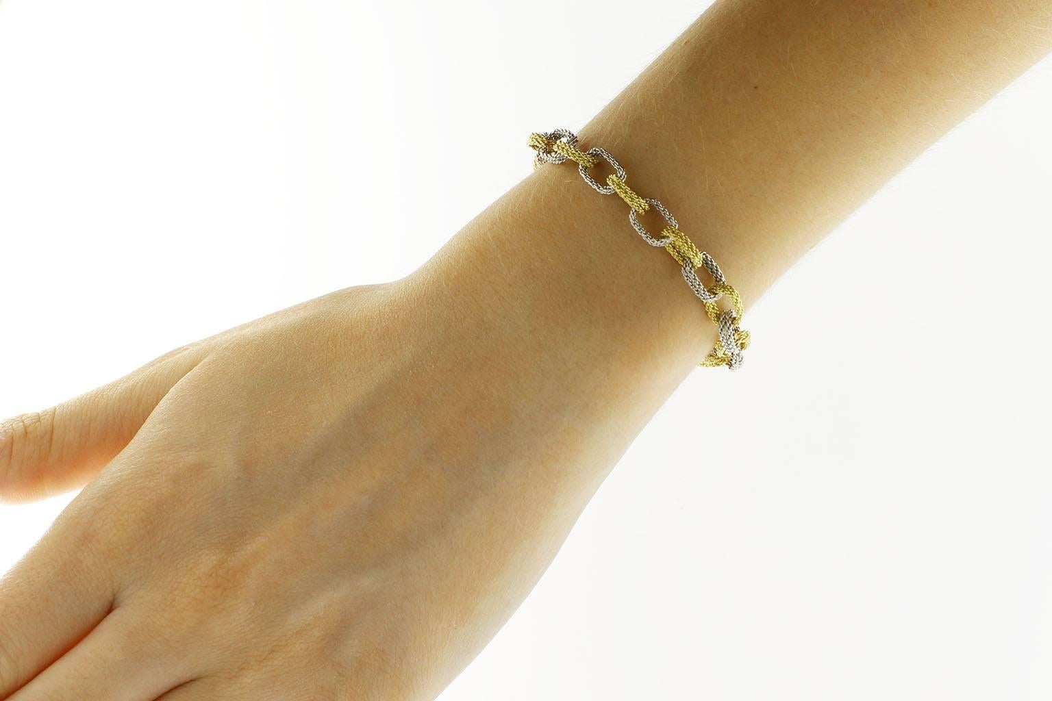 Jona design collection, hand made in Italy, 18 Karat woven yellow and white gold chain bracelet.
All Jona jewelry is new and has never been previously owned or worn. Each item will arrive at your door beautifully gift wrapped in Jona boxes, put