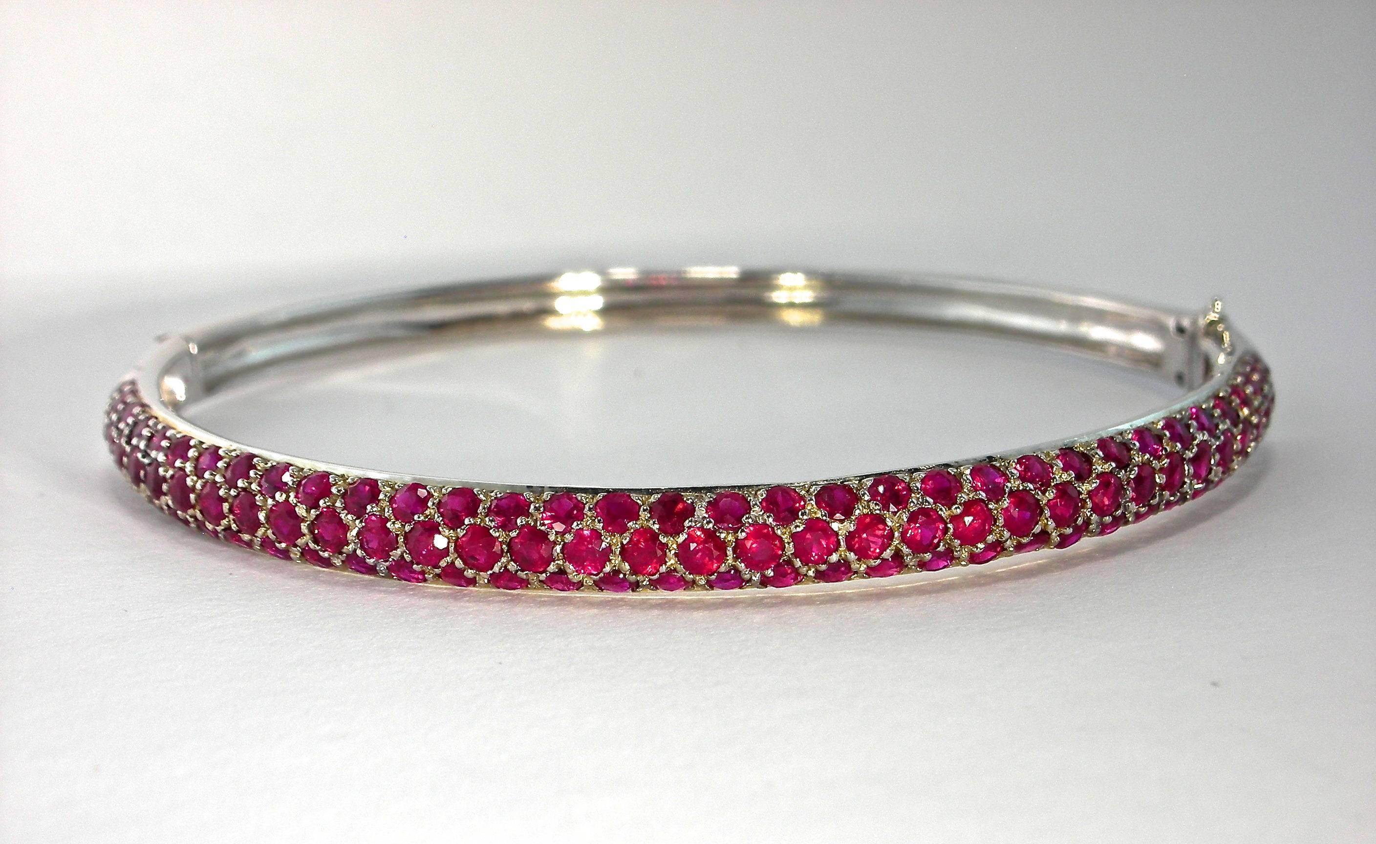Jona design collection, hand crafted in Italy, 18 karat white gold bangle bracelet. The ruby pavé is set with 103 burmese rubies for a total weight of 4.83 carats.

All Jona  jewelry is new and has never been previously owned or worn.

