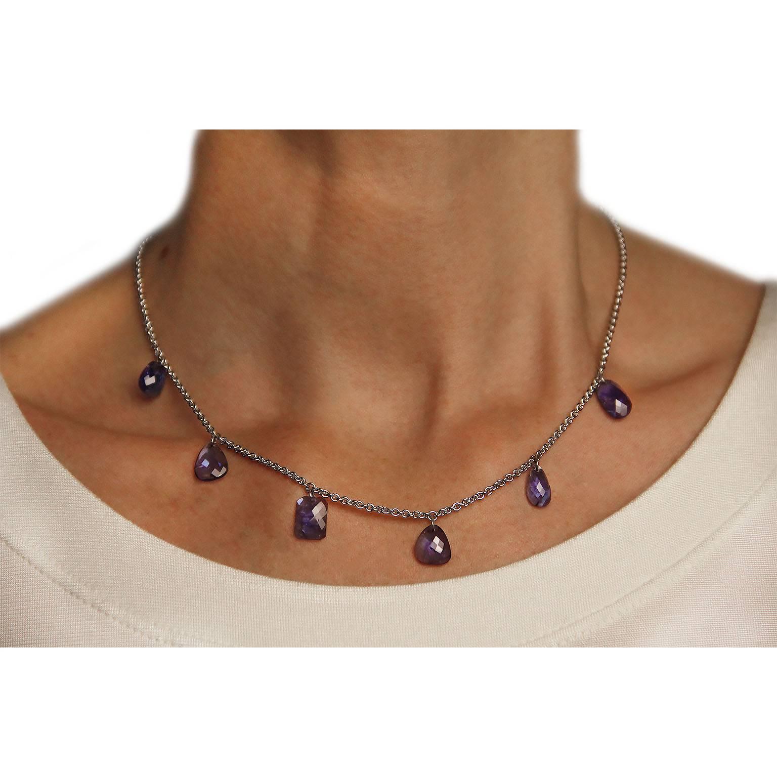 Jona design collection, hand crafted in Italy, 18 karat white gold chain necklace featuring 6 flat cut, multiple shape, intense blue tanzanite pendants, weighing 13.84 carats in total.
All Jona jewelry is new and has never been previously owned or