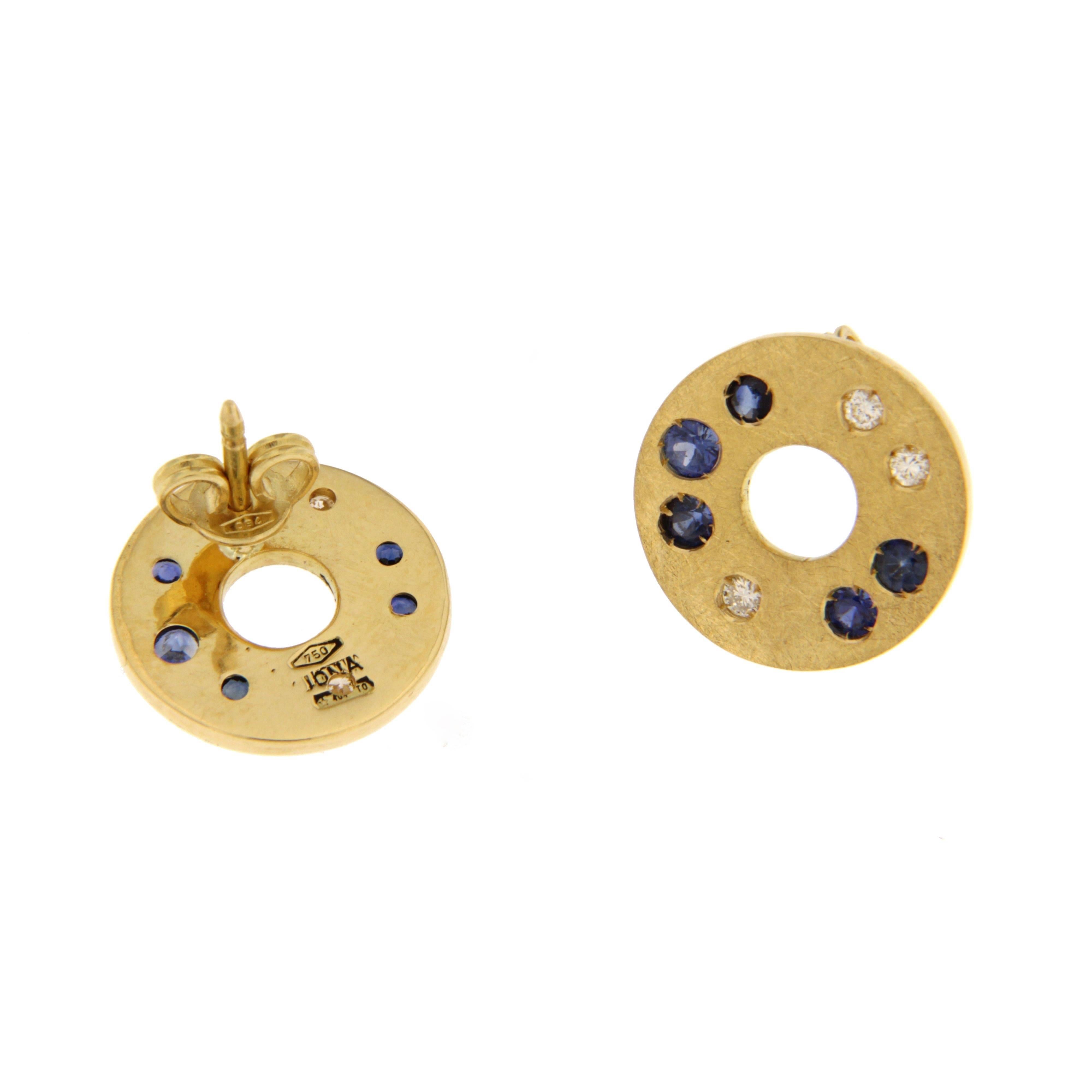 Jona design collection, hand crafted in Italy, 18 karat brushed yellow gold stud earrings set with brilliant cut white diamonds (ct. 0.19) and blue sapphires (ct. 0.56).

All Jona jewelry is new and has never been previously owned or worn. Each item