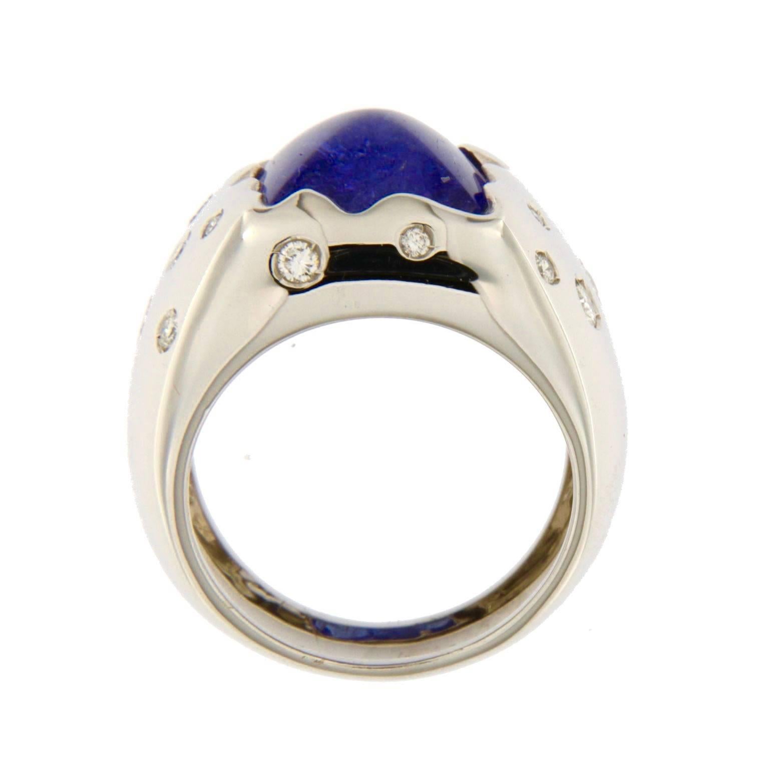 Jona design collection, 18 karat white gold ring, centering a cabochon Tanzanite weighing 7.67 carats, accented with 16 white diamonds weighing 0.35 carats. 

All Jona jewelry is new and has never been previously owned or worn. Each item will arrive