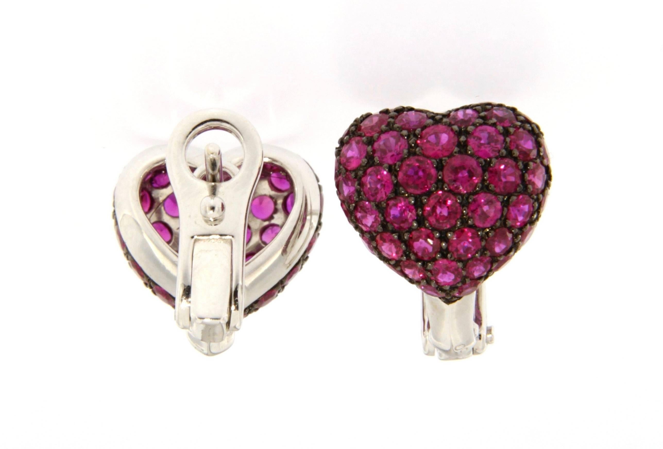 Jona design collection, hand crafted in Italy, 18 karat white gold, bombé heart  clip-on earrings, set with 3.53 carats of Burmese Rubies, with dark rhodium over setting.  
All Jona jewelry is new and has never been previously owned or worn. Each
