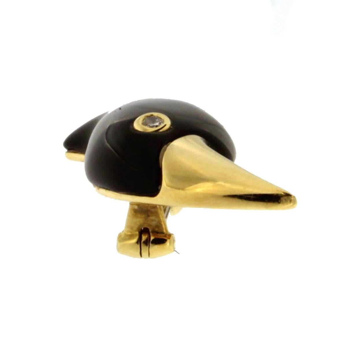 Jona design collection, 18 karat yellow gold toucan shaped brooch, set with a black onyx body and a white diamond eye.    
All Jona jewelry is new and has never been previously owned or worn. Each item will arrive at your door beautifully gift