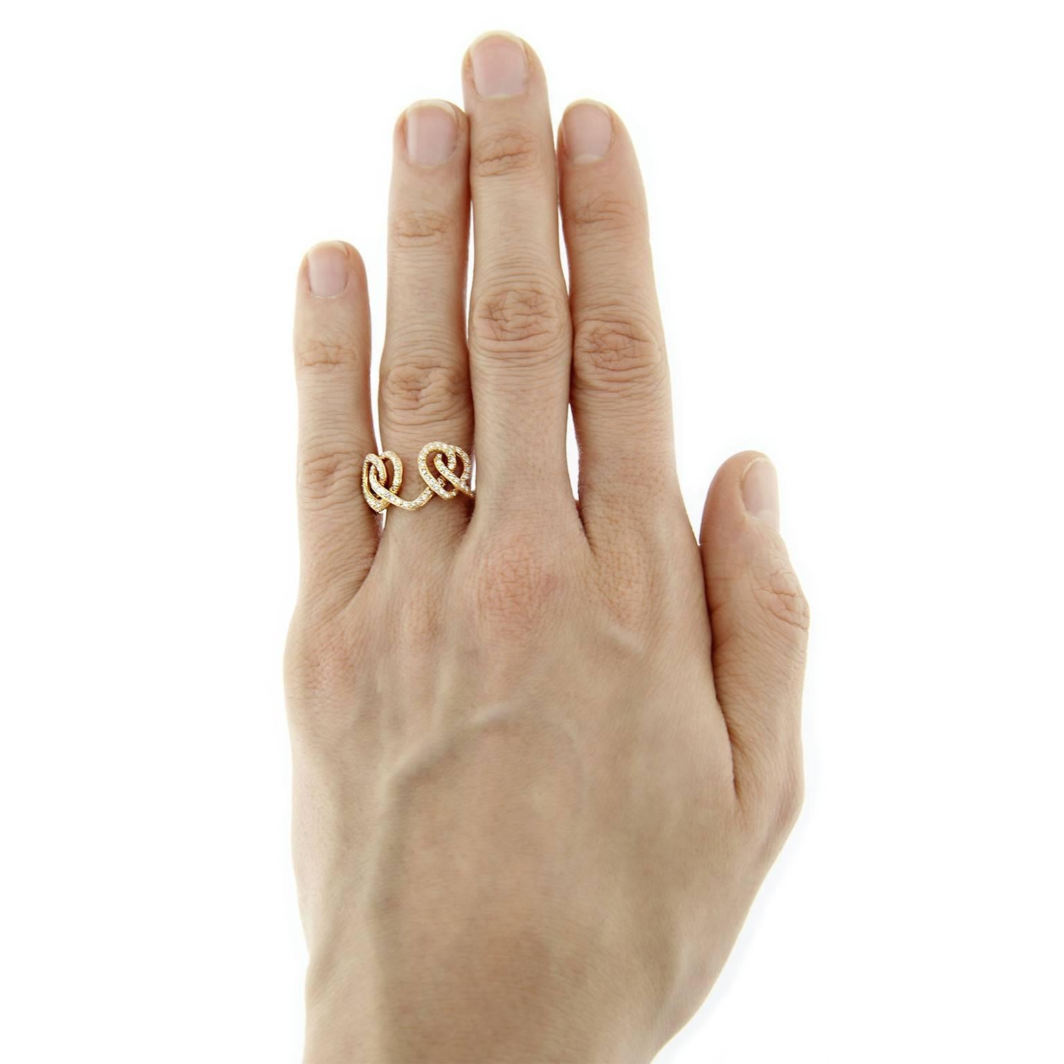 Jona design collection, hand crafted in Italy, 18 karat yellow gold intersecting open heart ring, set with 0.39 carats of white diamonds, F color, VS1 clarity.  US size 6.5. Can be sized to any specification. 
All Jona jewelry is new and has never
