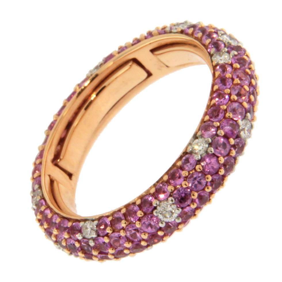 Jona design collection, hand crafted in Italy, 18 karat rose gold ring band, set with 2.85 carats of brilliant cut pink sapphires and 0.35 carats of white diamonds. 
Ring size US 7.5 . This ring has inner flexible segments in order to adapt to 