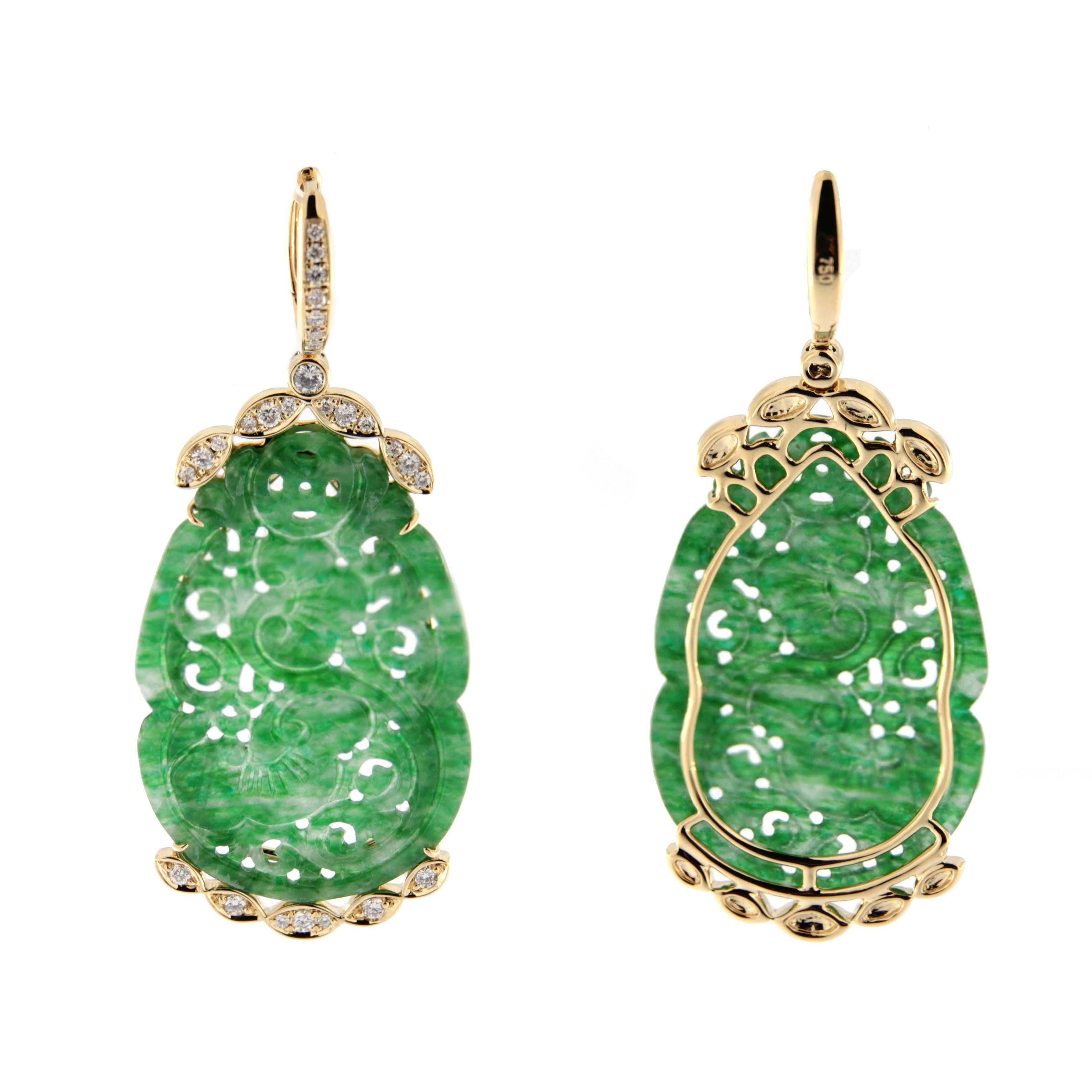 Jona design collection, hand crafted in Italy, 18 karat yellow gold dangle earrings, consisting of 2 carved Burmese jade elements adorned with 0.53 carats of white diamonds.   

All Jona jewelry is new and has never been previously owned or worn.