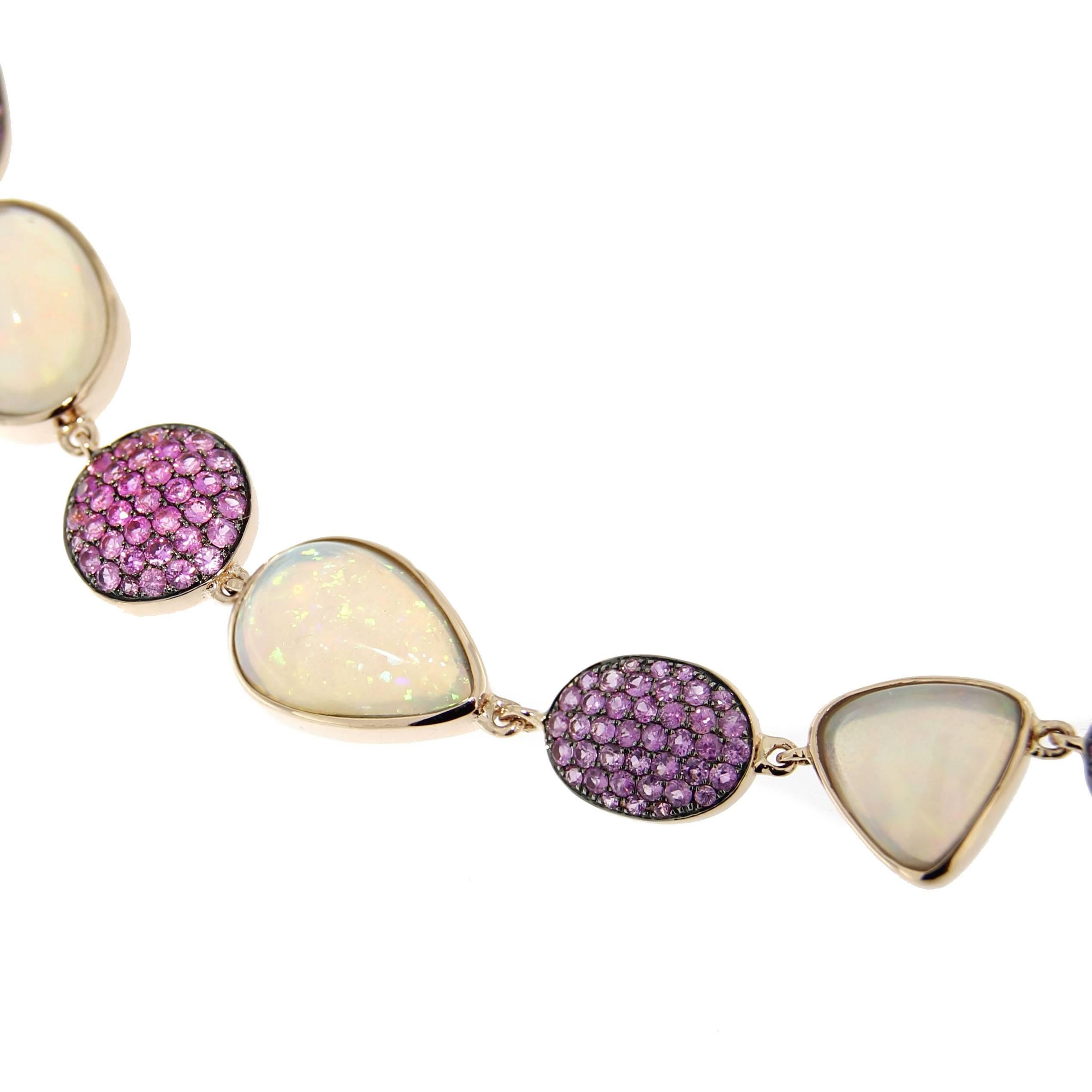 Jona design collection, hand crafted in Italy, 18 karat rose gold necklace, consisting of alternating opal cabochons with pink sapphire pavé links.
Total stone weight: Opals 21.60 cts. , Pink Sapphires 4.10 cts.
All Jona jewelry is new and has