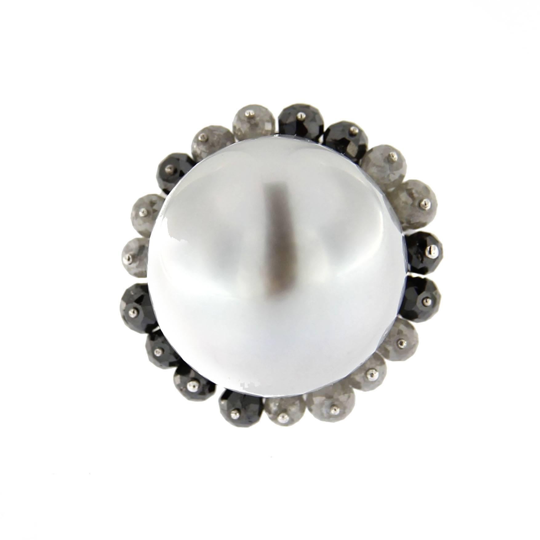 Jona design collection, handcrafted in Italy, 18k white gold dome ring centering a large white baroque south sea pearl surrounded by black & ice grey briolette cut diamonds. Signed Jona.
US size 6.2 (can be sized).

All Jona jewelry is new