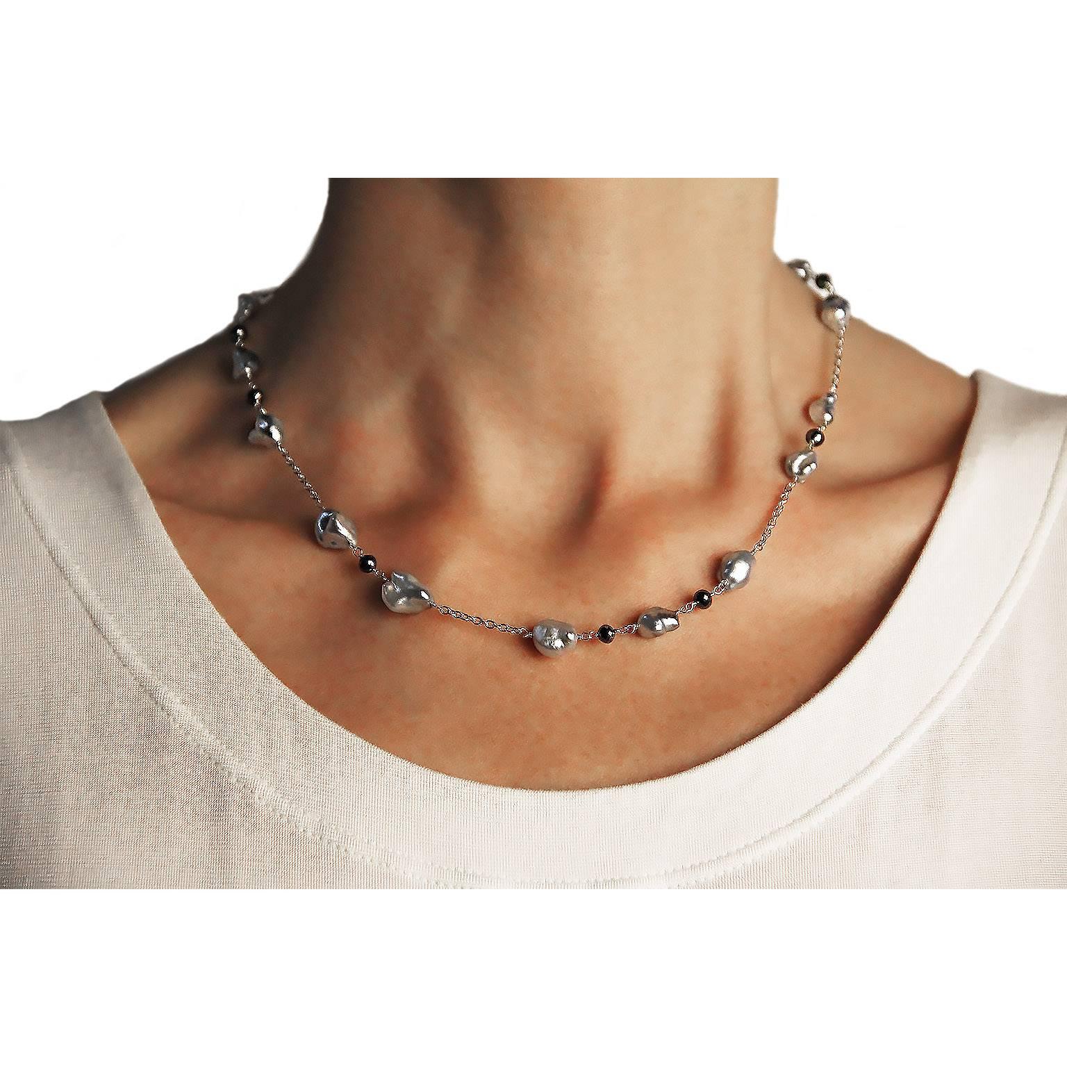 Jona design collection, hand crafted in Italy, 18 karat white gold, 18.5 in/47 cm long necklace with 16 keshi grey Tahiti pearls, alternating with 10 briolette cut black diamonds.

All Jona jewelry is new and has never been previously owned or