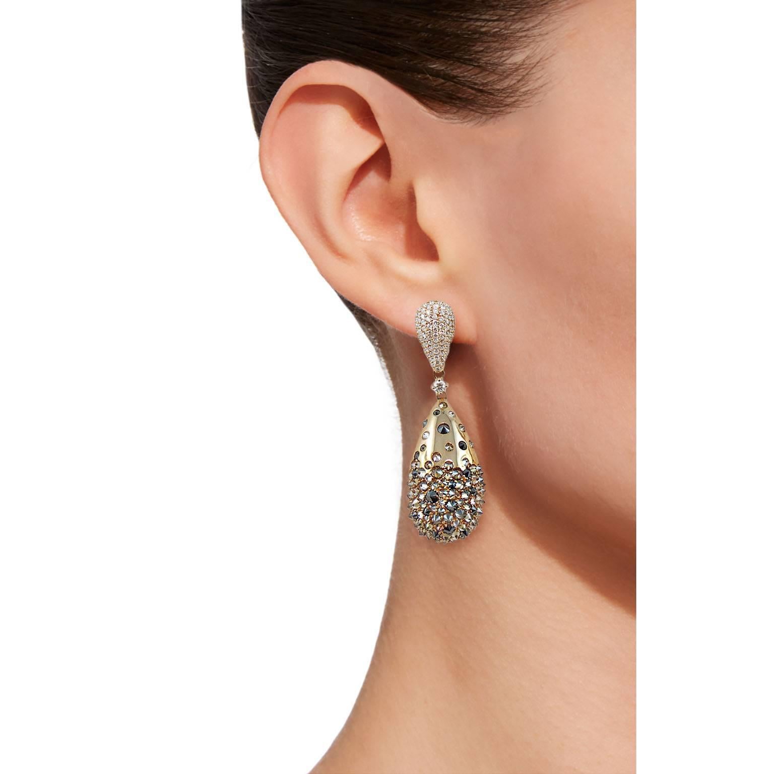 One pair of drop ear clip pendants by Jona. The earrings feature 4.28 carats of black diamonds, 1.21 carats of brown diamonds and 1.83 carats of white diamonds, F Color, VVS1 Clarity. Hand crafted in Italy, signed Jona.
All Jona jewelry is new and
