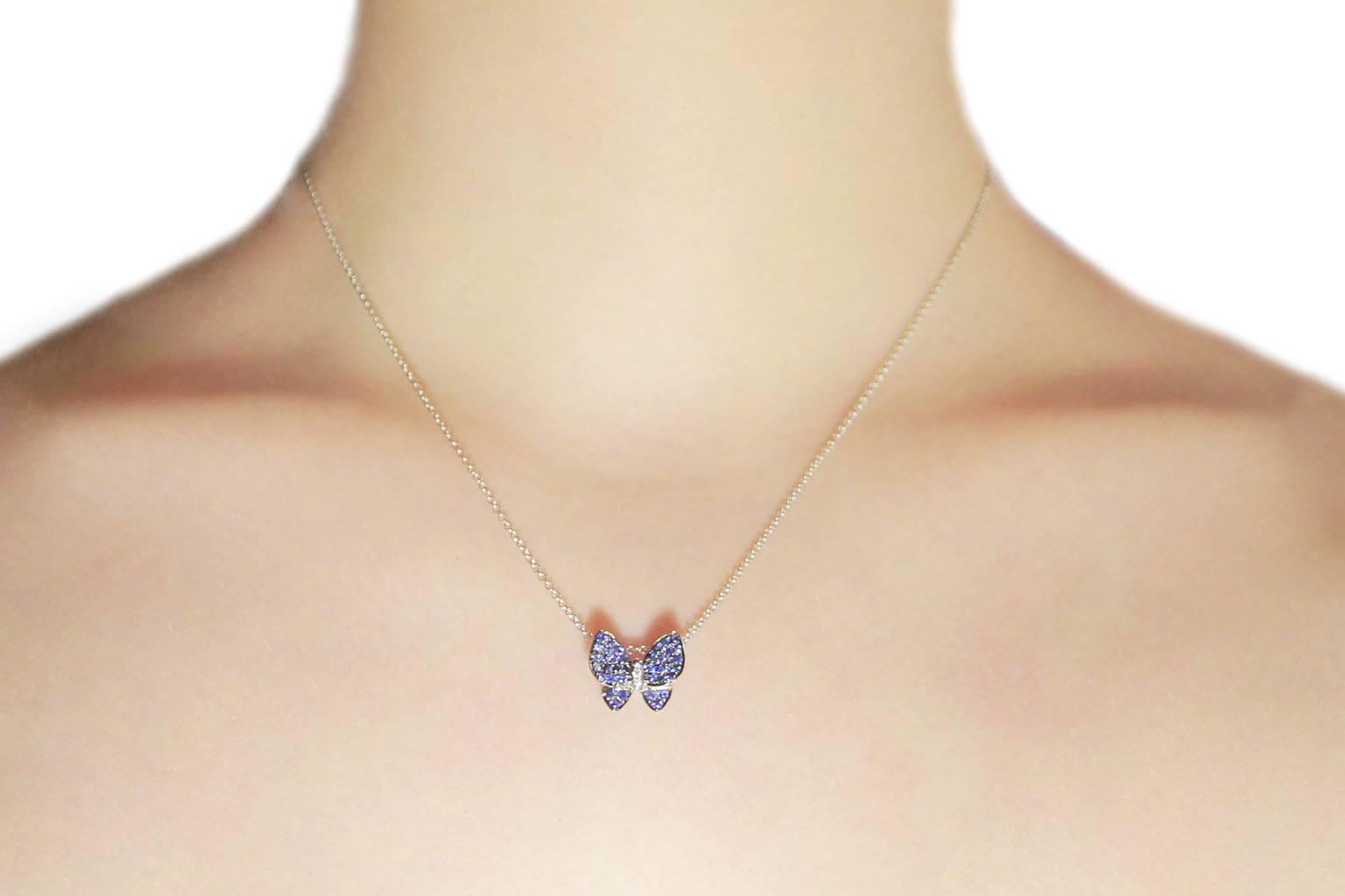 Jona design collection, hand crafted in Italy, blue sapphire (0.38 ct, 38 pieces) and white diamonds (0.01 ct, 2 pieces) 18 karat white gold butterfly pendant necklace, mounted on 18 karat white gold chain, 17.71 inch long. 
All Jona jewelry is new