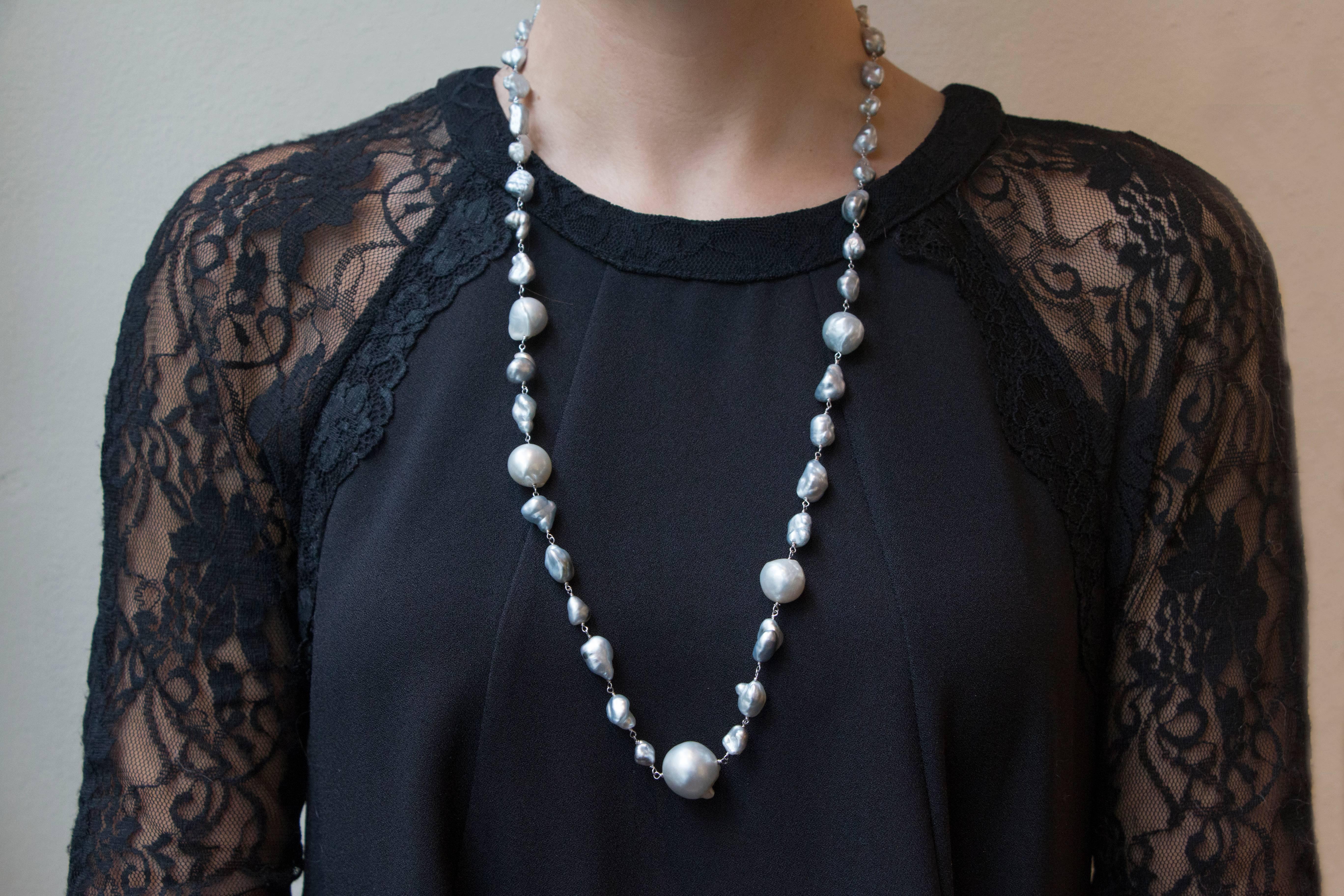 Jona design collection, hand crafted in Italy, 18 karat white gold necklace featuring 45 light grey baroque South Sea pearls weighing 43.01 carats.
Dimensions: 28.34 in. L x 0.69 in. W - 72 cm. L x 1.7 cm. W
All Jona jewelry is new and has never