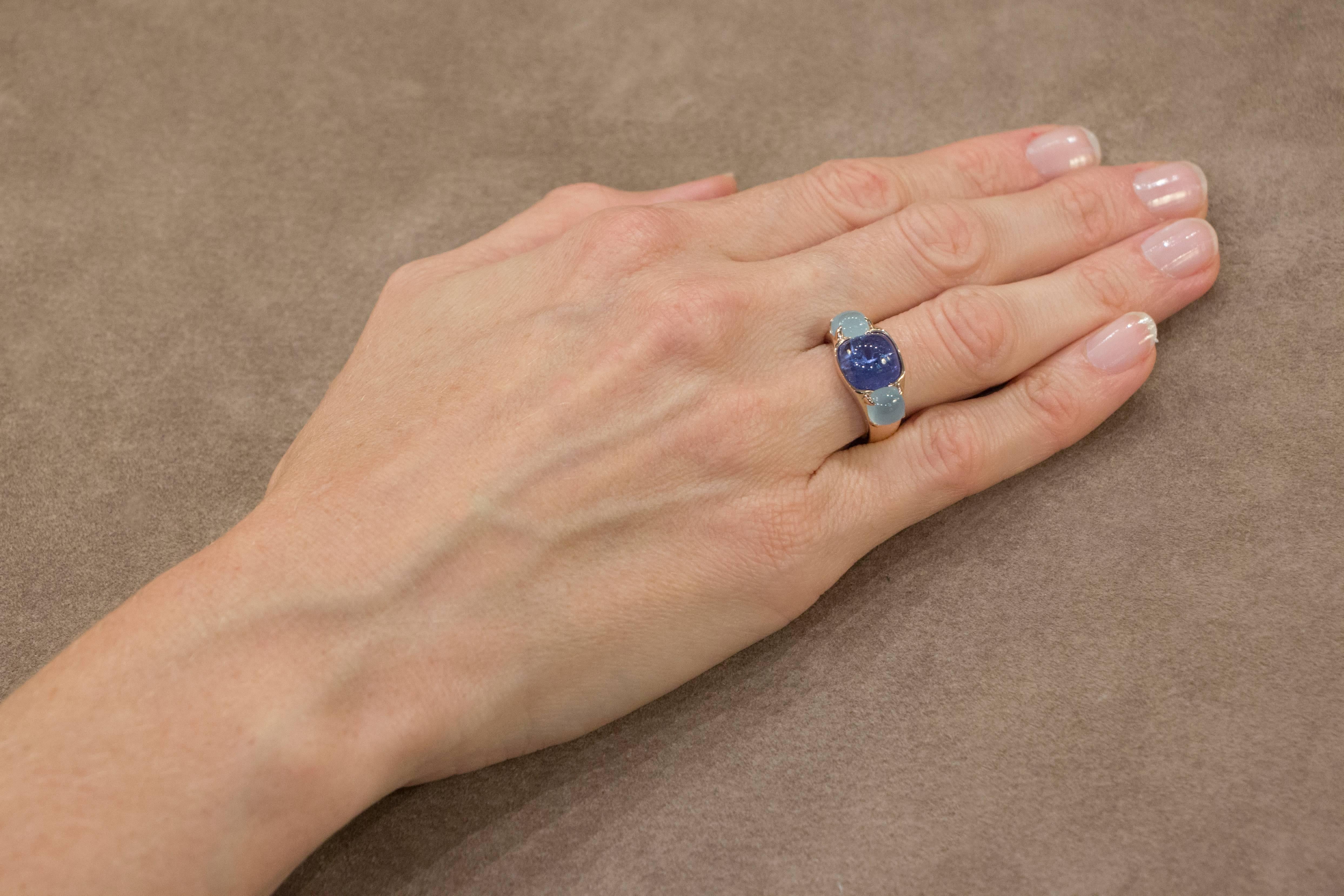 Jona design collection, hand crafted in Italy, 18 karat rose gold ring centering a cabochon Tanzanite weighing 5.80 carats, enhanced by two square cut aquamarines 1,43 carat each.Ring size US. 6.5, can be sized to any specification. 