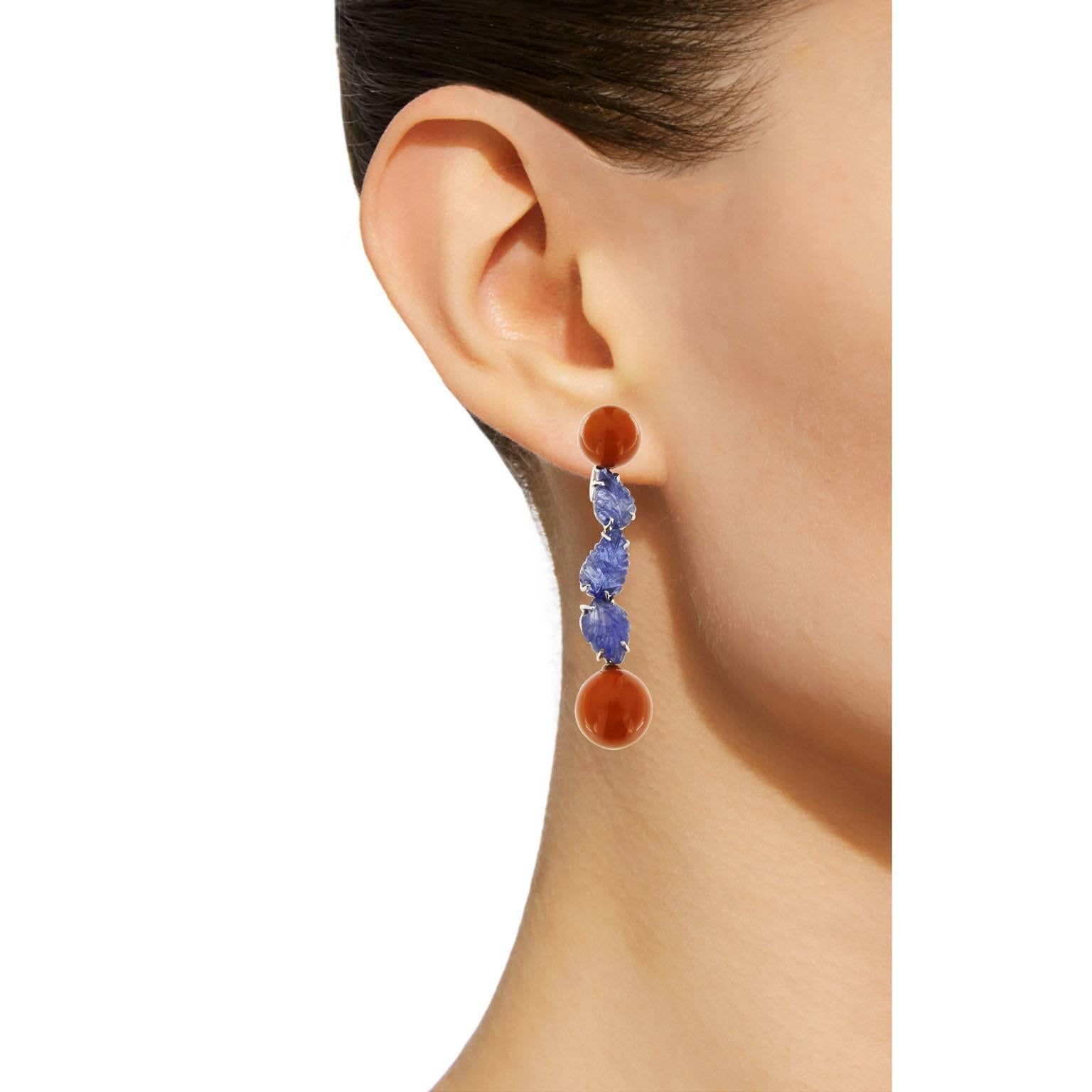 Jona design collection, hand crafted in Italy, 18 karat white gold dangle earrings set with four Mediterranean Coral spheres and six carved Blue Sapphire leaves. Dimensions: 2.28 in. H x 0.42 in. W x 0.55 in. D - 57 mm. H x 10 mm. W x 14 mm. D
All