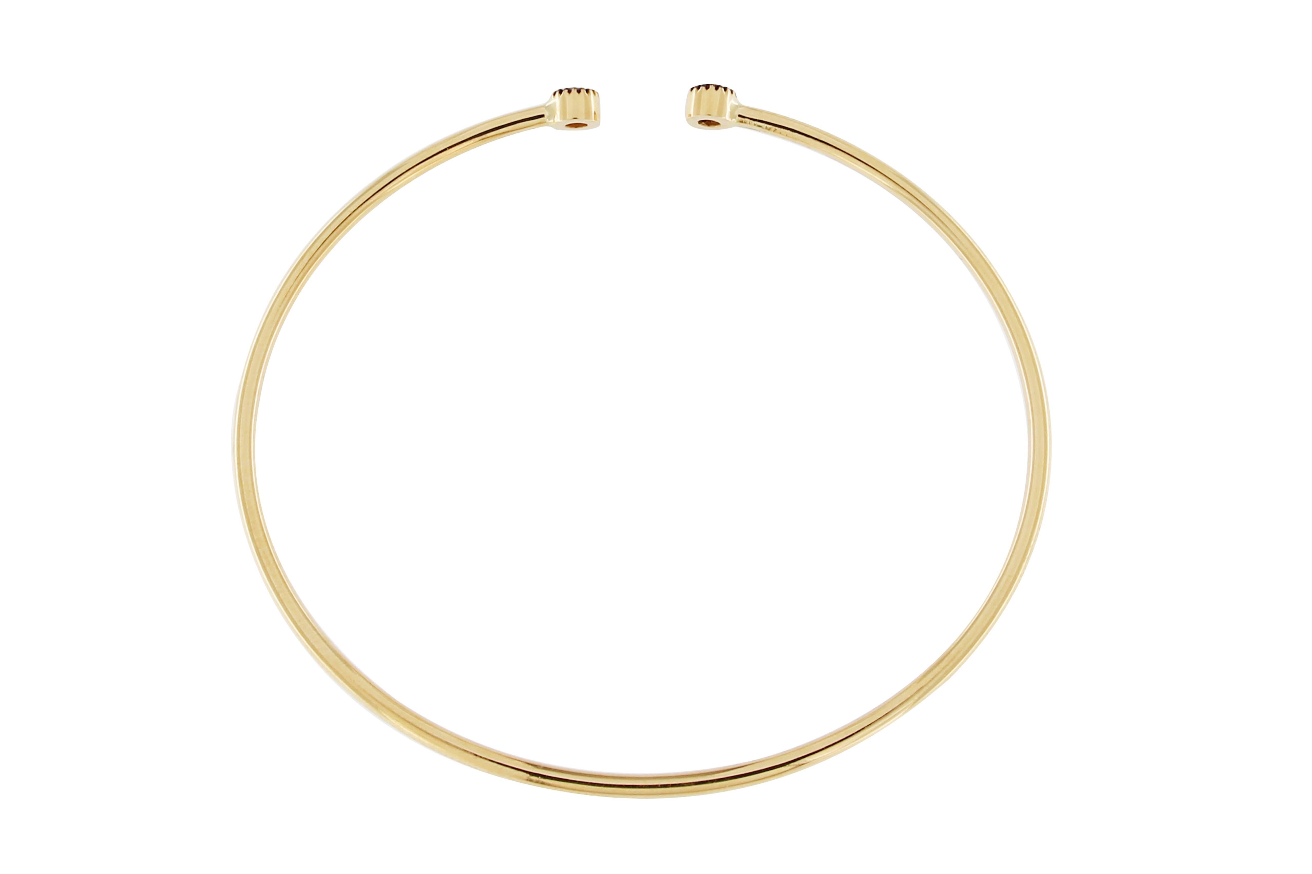 Jona design collection, hand crafted in Italy, 18 karat yellow gold bangle bracelet set with two round cut natural rubies weighing in total 0.31 carats.
Dimensions:
2.09 in. H x 2.32 in. W x 0.14 in. D
53 mm. H x 59 mm. W x 4 mm. D
All Jona jewelry