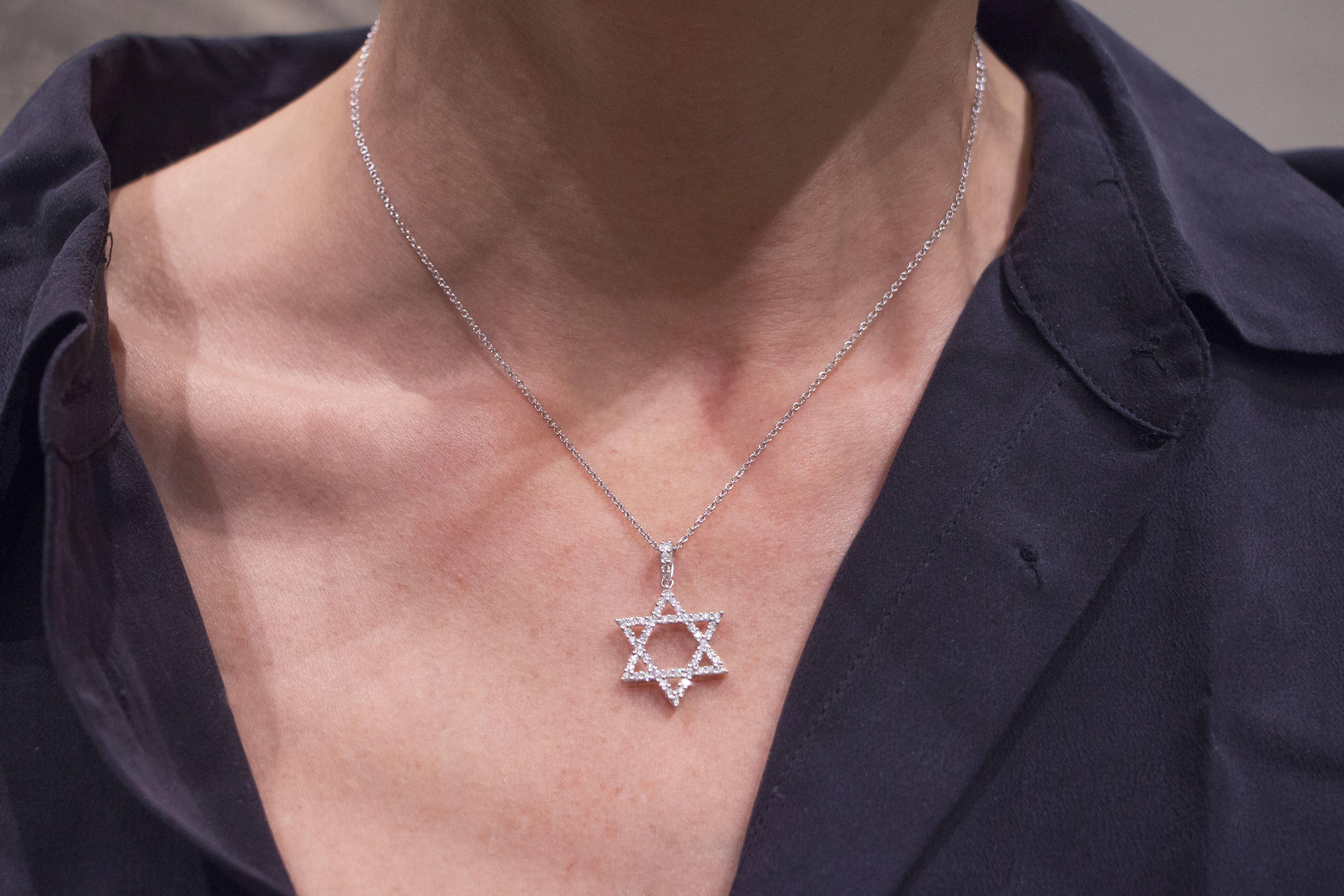 Jona design collection, hand crafted in Italy, 18 karat white gold Magen David pendant, set with 0.52 carats of white diamonds, suspended by a 18 karat white gold chain necklace 16.5 inch long(also available in other lengths).Dimensions: 0.78 in