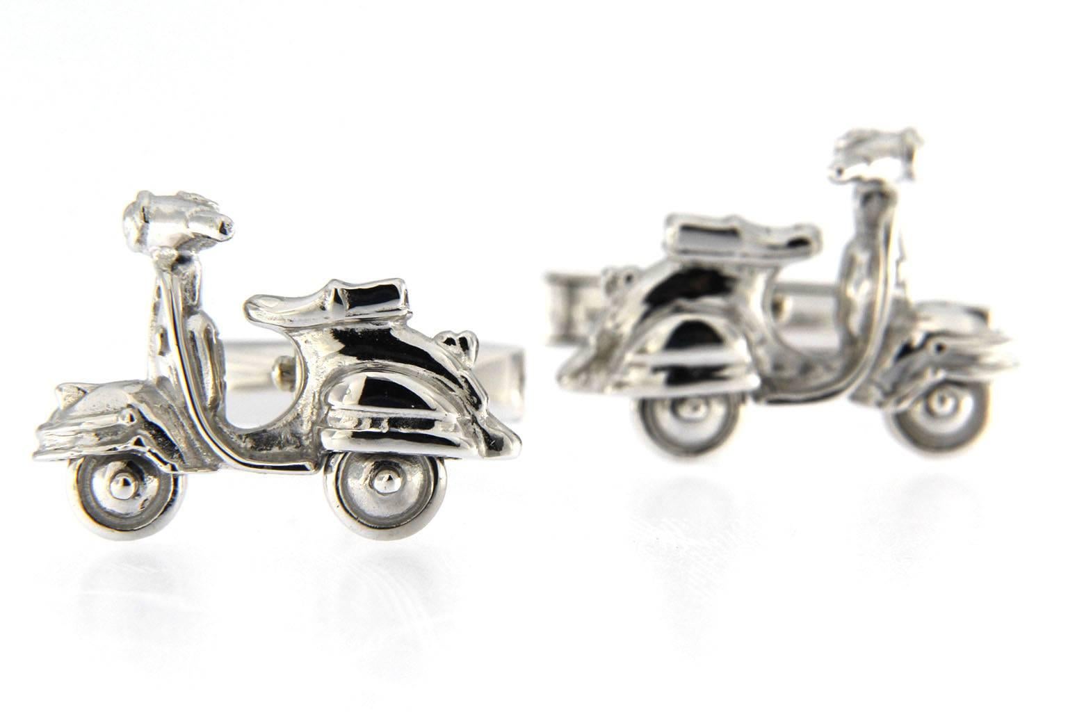 Jona design collection, hand crafted in Italy, sterling silver scooter cufflinks with rotating wheels and black enamel.
Dimensions : H 0.65 in x W 0.90 in x D 0.20 in - H 16.60 mm x W 23.05 mm X D 5.17 mm.
All Jona jewelry is new and has never been