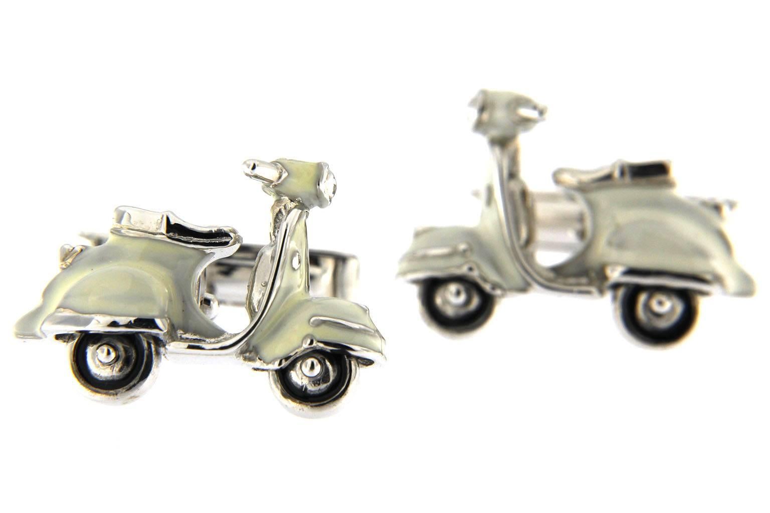 Jona design collection, hand crafted in Italy, sterling silver scooter cufflinks with rotating wheels and black enamel.
Dimensions : H 0.65 in x W 0.90 in x D 0.20 in - H 16.60 mm x W 23.05 mm X D 5.17 mm.
All Jona jewelry is new and has never been
