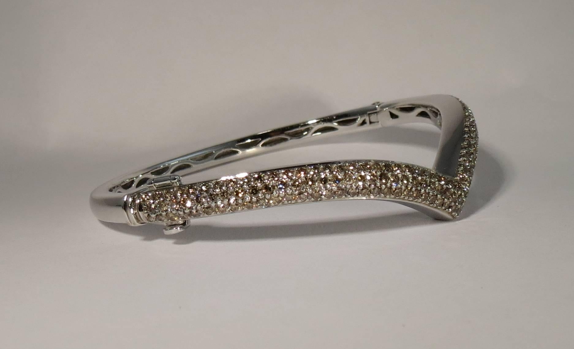 Jona design collection, hand crafted in Italy, 18 karat white gold bangle bracelet featuring 2.65 carats of champagne diamonds pavé (165 pieces).

All Jona jewelry is new and has never been previously owned or worn. Each item will arrive at your