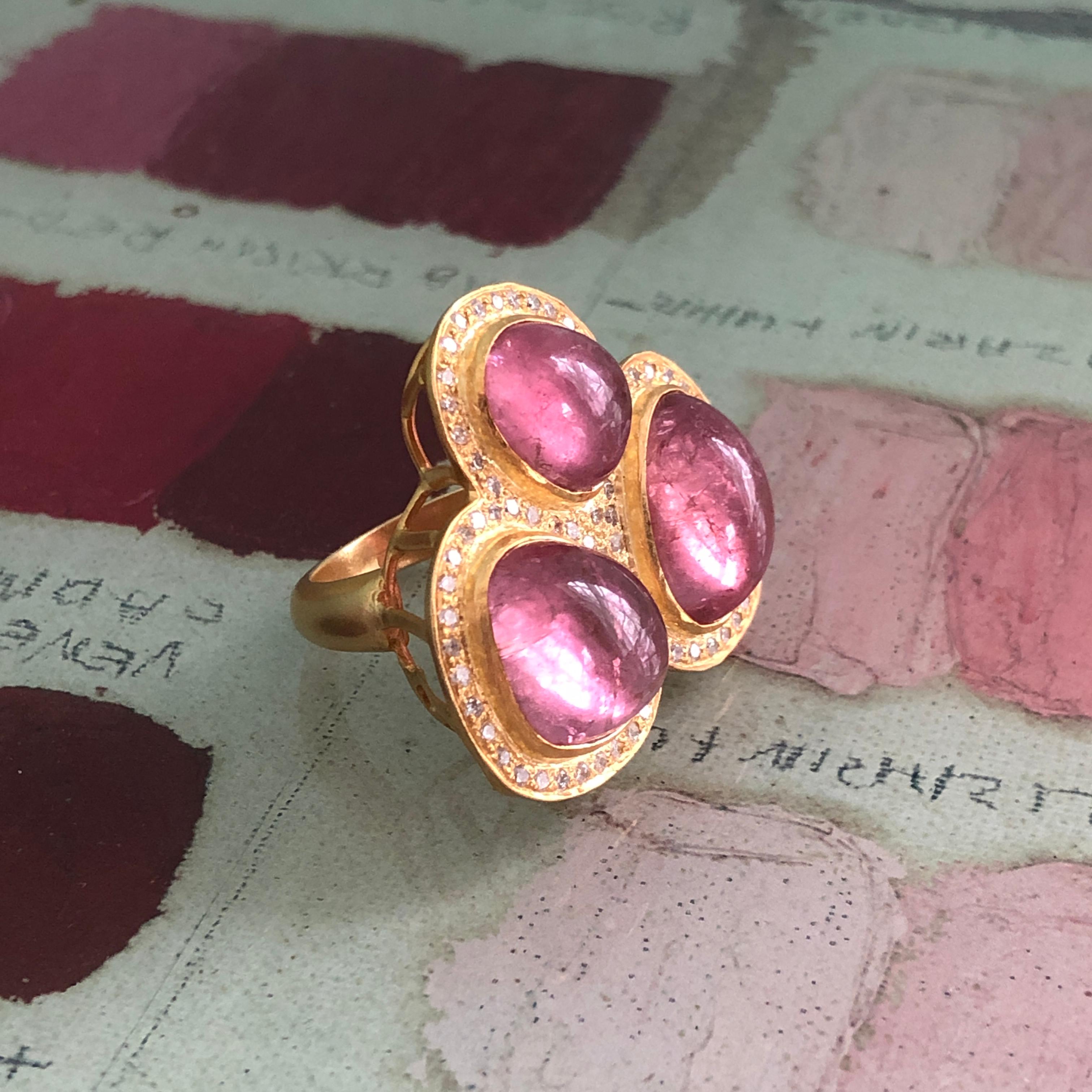 22.91 Carats of spectacular Pink Tourmaline cabochons are at the center of this statement ring design, surrounded by .81 carats Diamonds and Lauren Harper's signature warm matte 18 kt Gold.  This ring is a true wow ring!  Size 7.  Ships directly