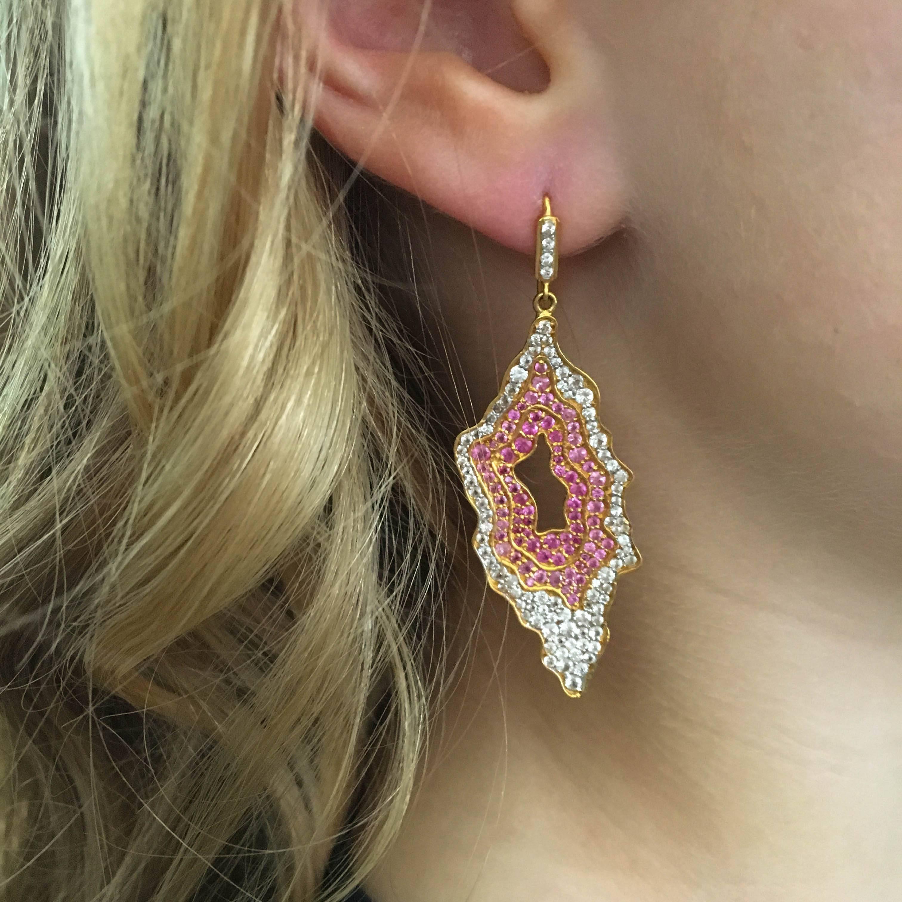 Designed to look like a sliced geodes but made out of pink and white sapphires, these earrings are spectacular and unique.  Lightweight on the ears.  Can be made on posts, upon request.  Stand out in any crowd with these fabulous statement earrings.