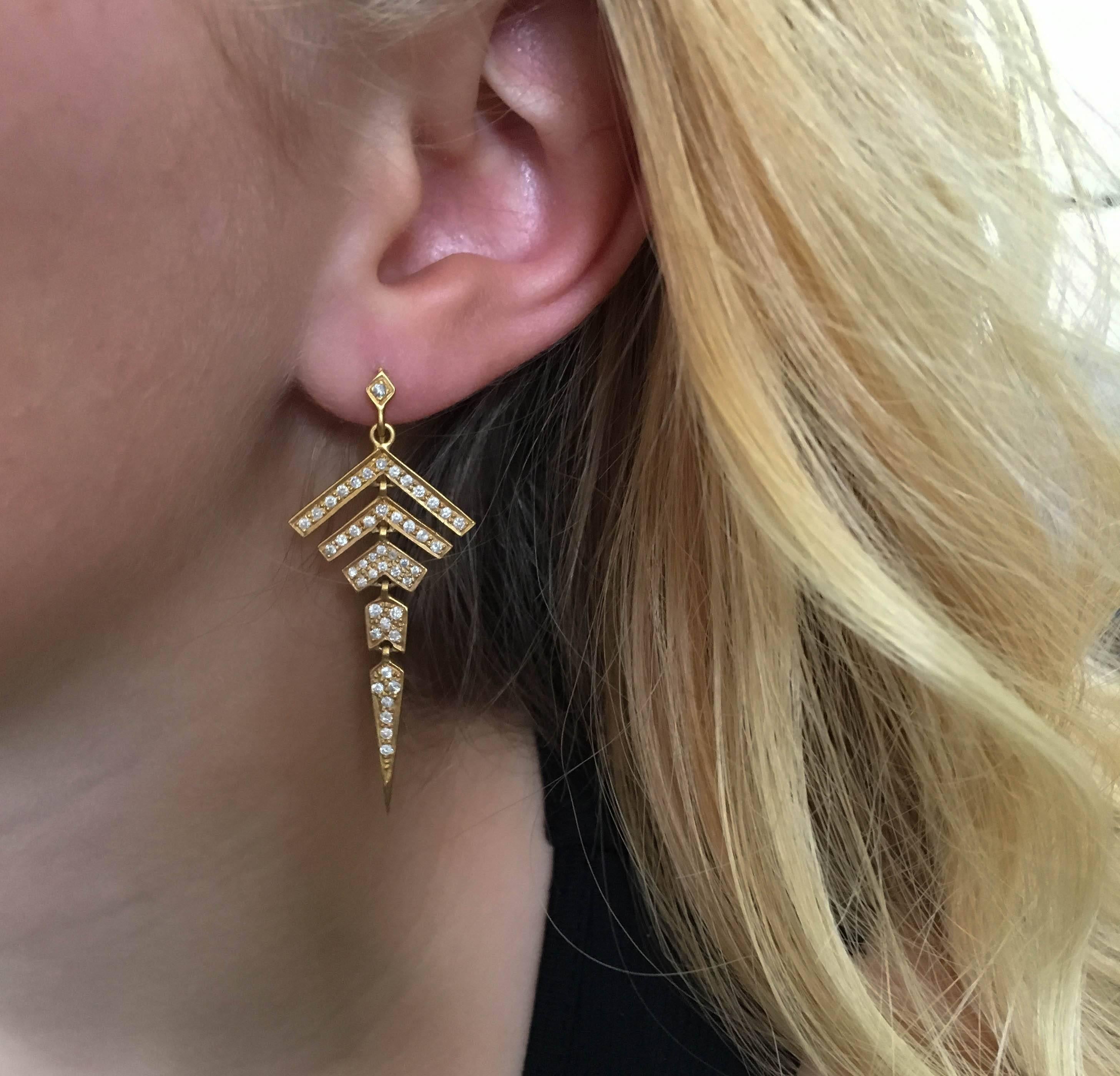 Architecturally inspired, these geometric .80 carat diamond and 18k matte gold arrow earrings are certain to point you in the right direction. These distinct earrings are lightweight and move fluidly. Special enough for any occasion, but edgy and