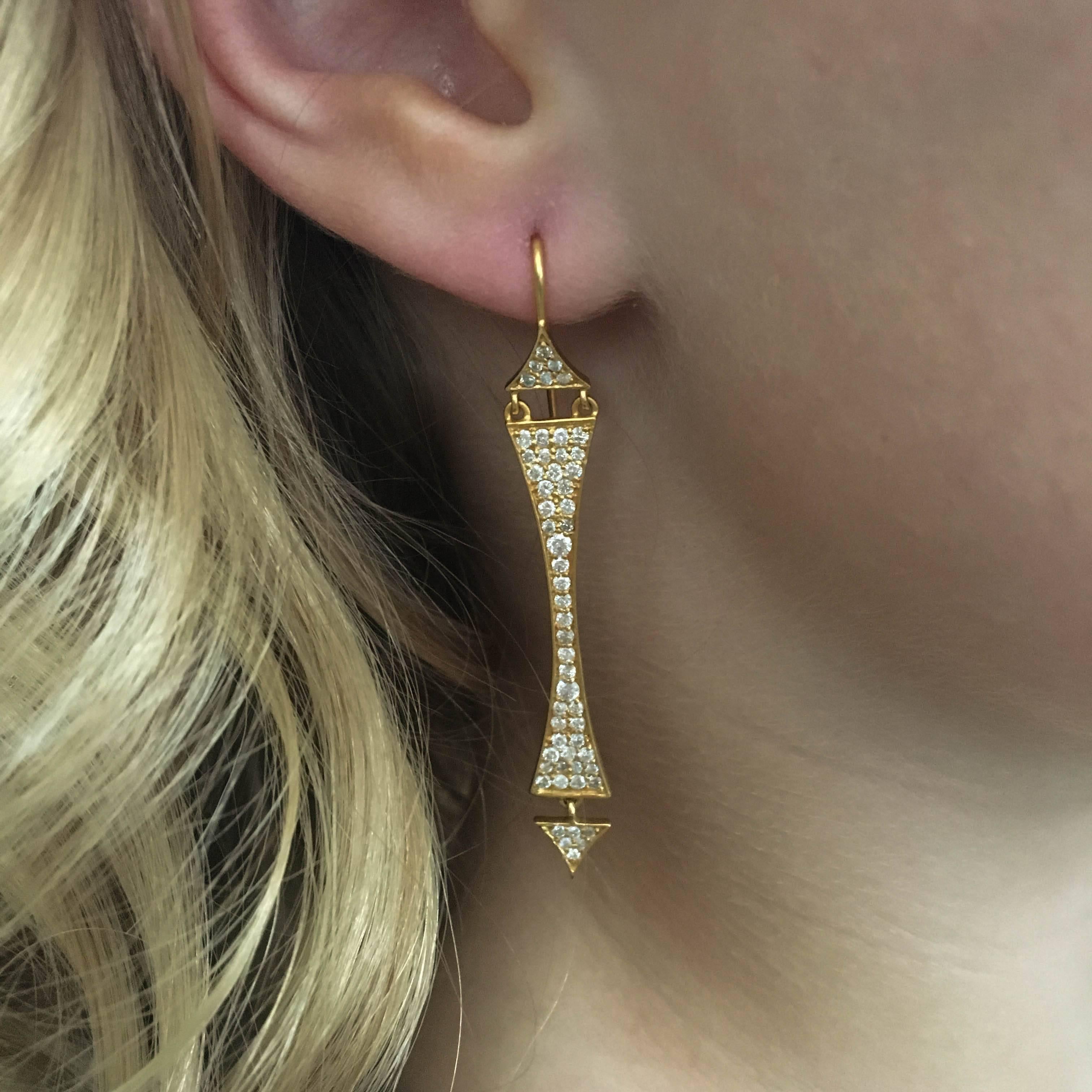 Architecturally inspired, these 18kt Gold and 1.28 carat diamond earrings are sure to get attention.  Matte Gold, extremely lightweight and jointed, so they move fluidly on the ear.  Lovely for any occasion.  Certain to get compliments!
