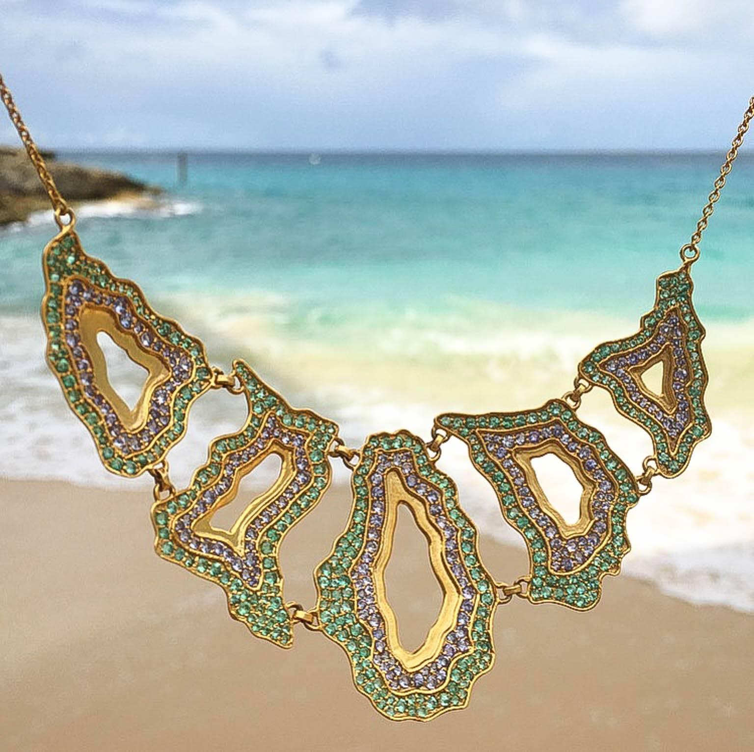 Truly spectacular, this colorful Emerald and Tanzanite necklace mimics the patterns and shapes of natural geodes and agates, but is entirely made out of precious stones and Lauren Harper's signature 18kt matte gold. Each of the 5 components lays