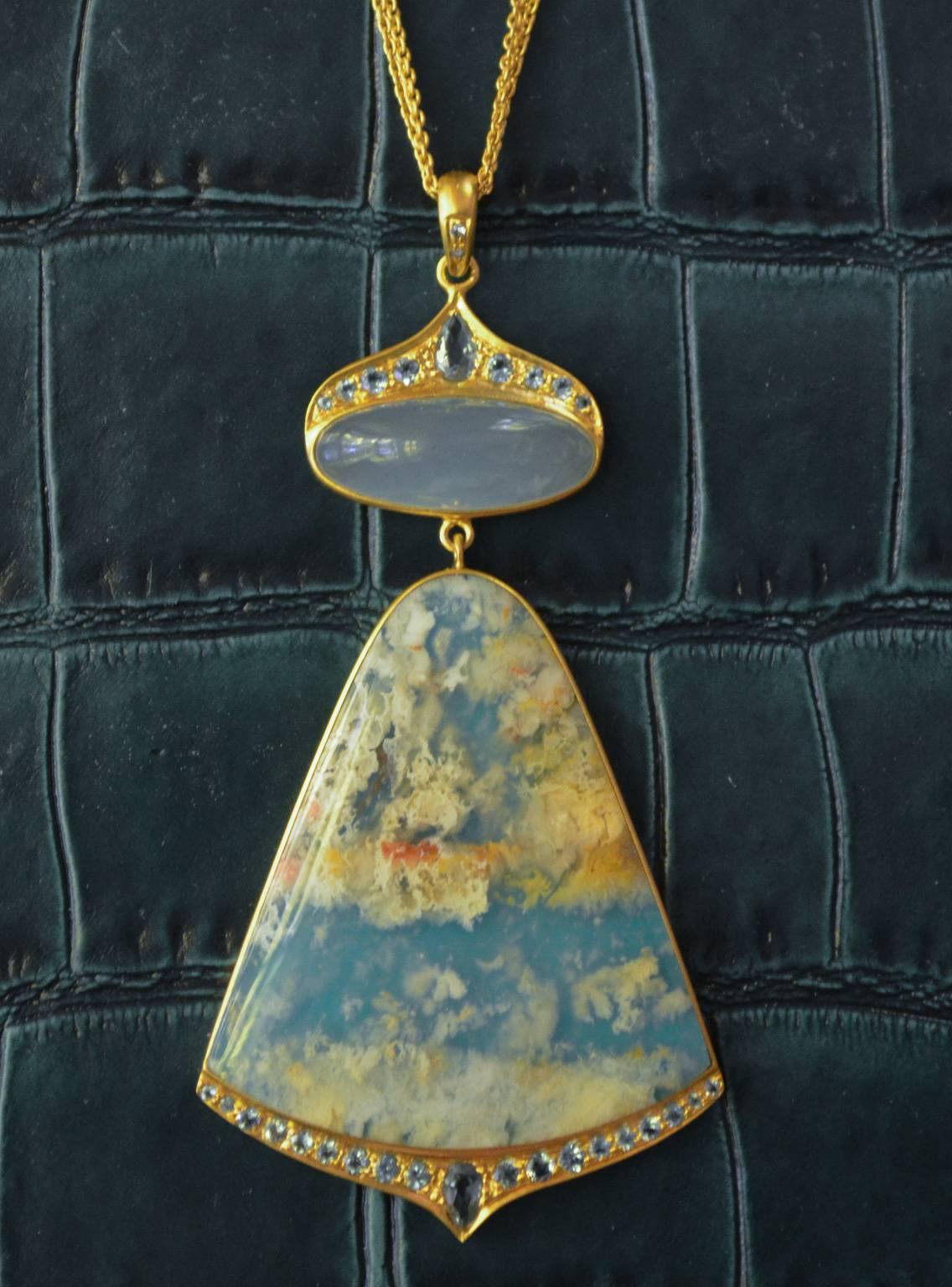 Truly a one of a kind, this pendant is beyond unique.  Lauren Harper has taken a translucent sea agate and set it on top of a turquoise composite, making a completely unique new stone that looks like clouds floating in the sky!  A cabachon