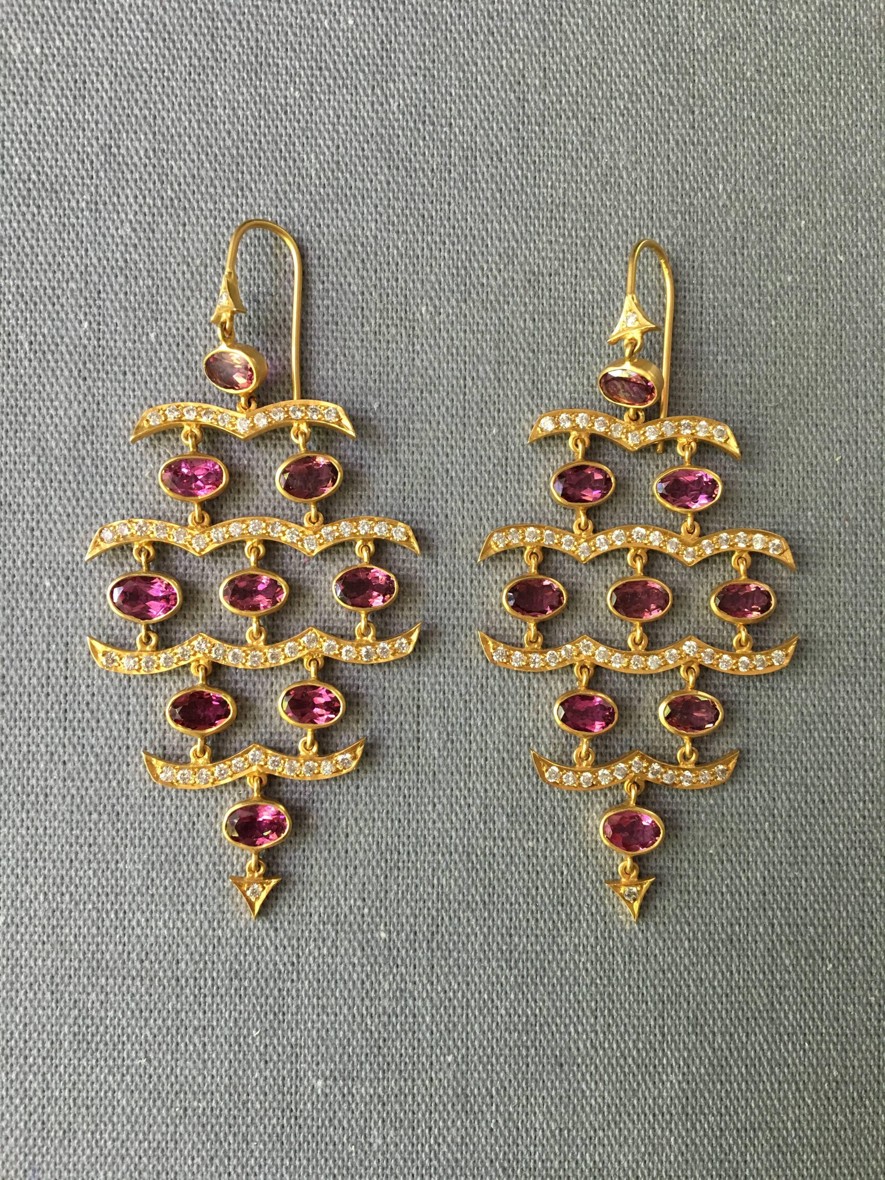 These spectacular earrings were inspired by ocean waves, with 1.5 Carats of White Diamonds embellishing Lauren Harper's signature 18kt Matte Gold finish, with bright pink faceted oval Pink Tourmalines. These earrings boast a big look, but are