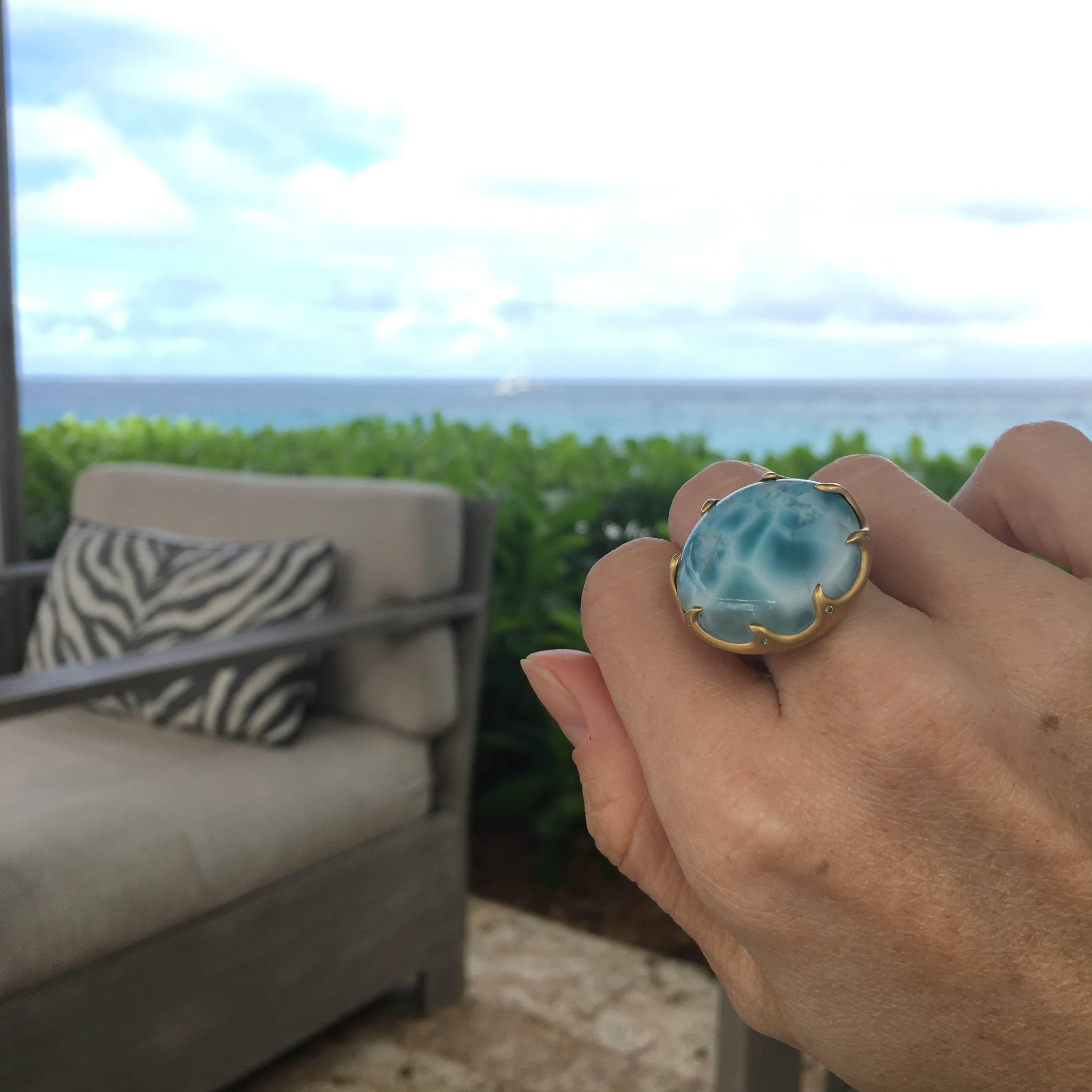 Truly a wow ring, this cabachon round Larimar is a one of a kind beauty.  This Larimar has vibrant blue sky tone to it, with a pattern to it that resembles moving water.  Inspired by the ocean like qualities of the stone (found in only one place in