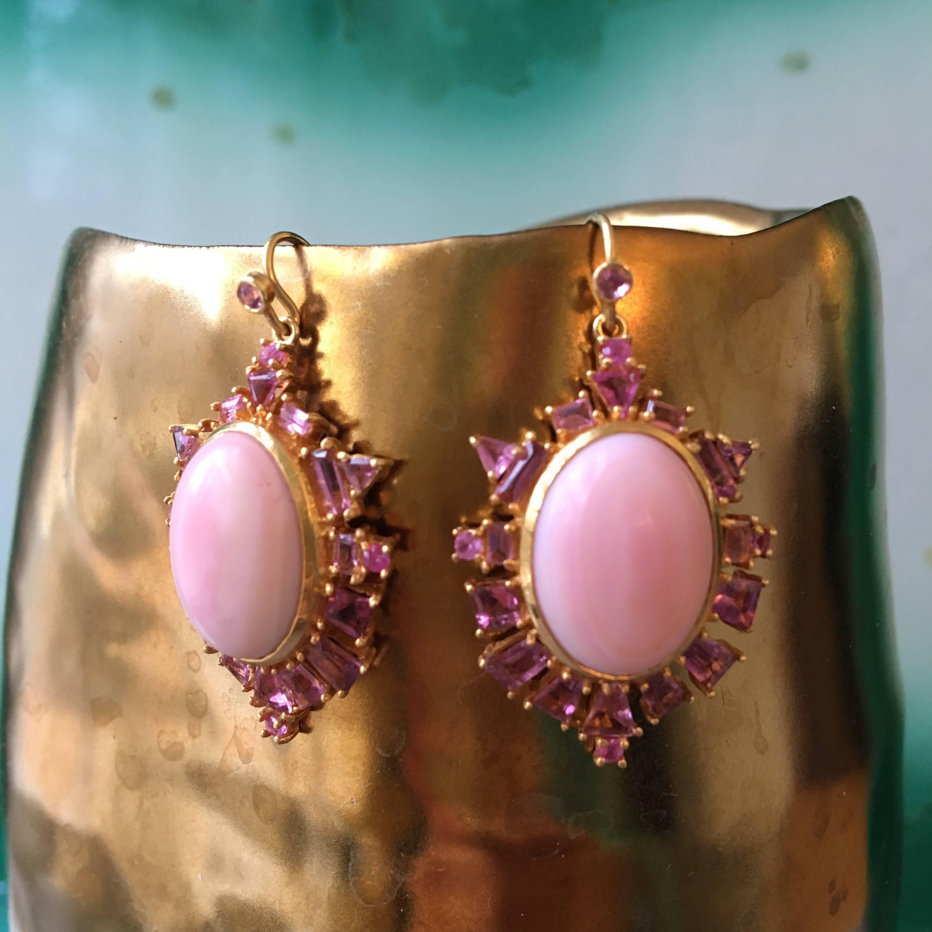 Feel like royalty in these beautiful pink opal and pink sapphire earrings!  Cabachon Pink Coral ovals are soft in color, but balanced with bright pink geometrically shaped Sapphires, creating a spectacular overall design.  Set in Lauren Harper's