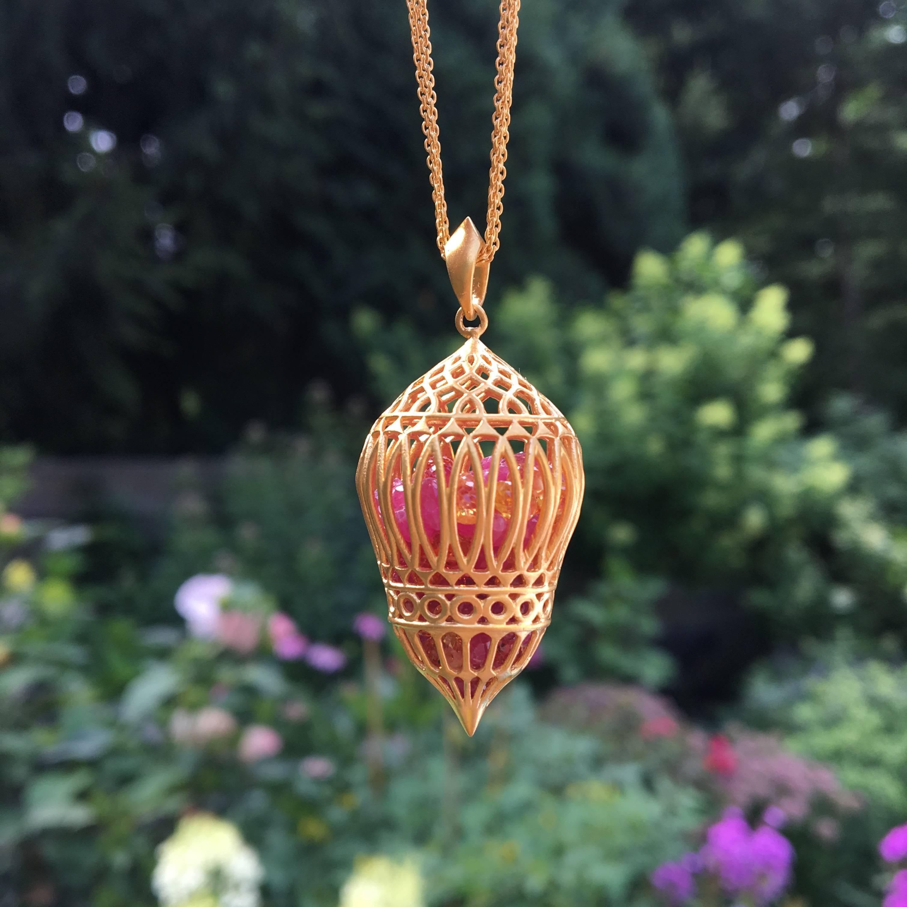Bright pink, yellow and orange sapphires move freely inside this intricate 18kt Gold cage pendant.  Inspired by the shapes of the Taj Mahal, this pendant is romantic and feminine and as unique as they come.  Finished in Lauren Harper's signature