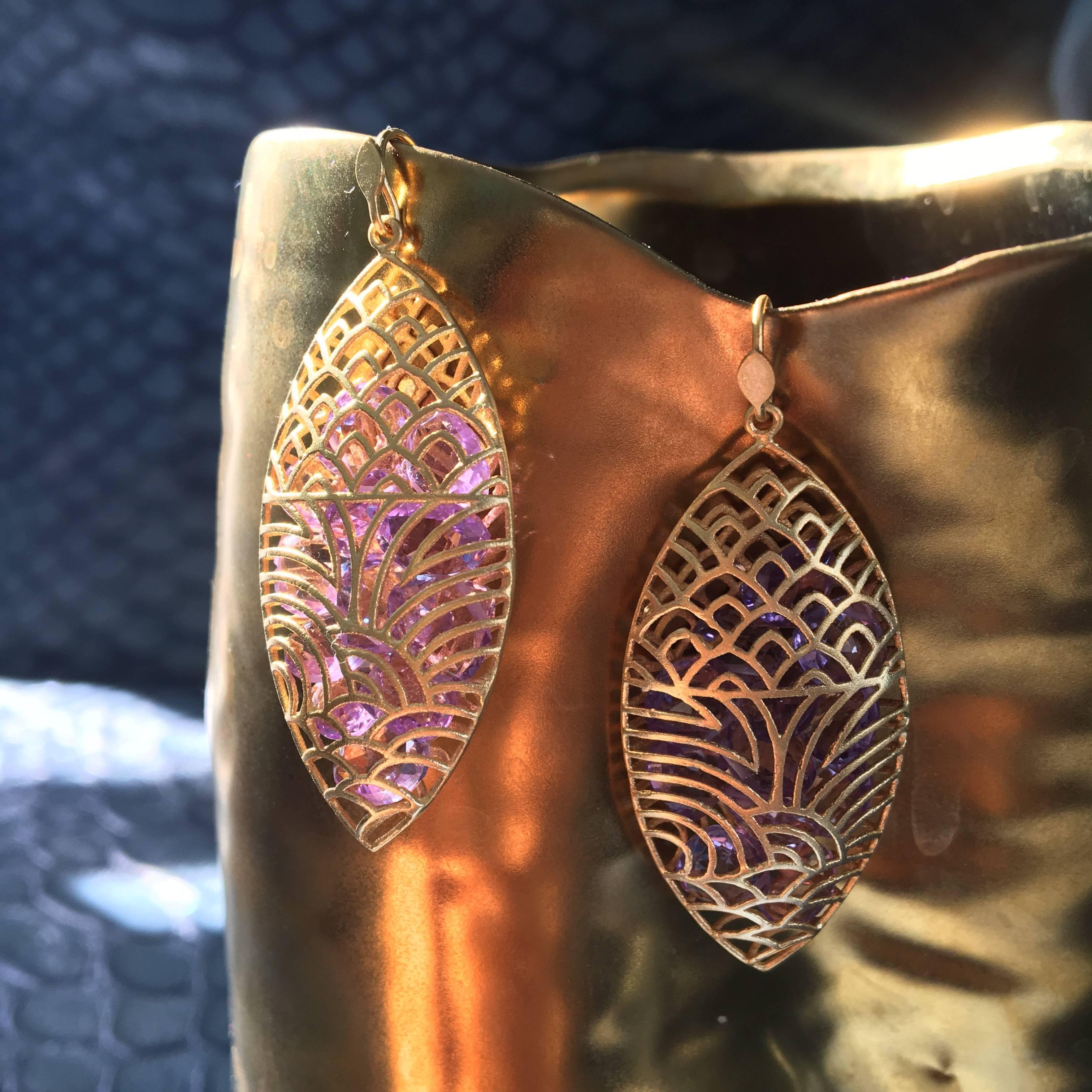 Amethysts float inside these 18kt yellow gold marquis shaped caged earrings, catching the light in a 
playful and unique design.  Finished in Lauren Harper's signature matte gold finish, these earrings are fabulous for evening or daytime.  Light