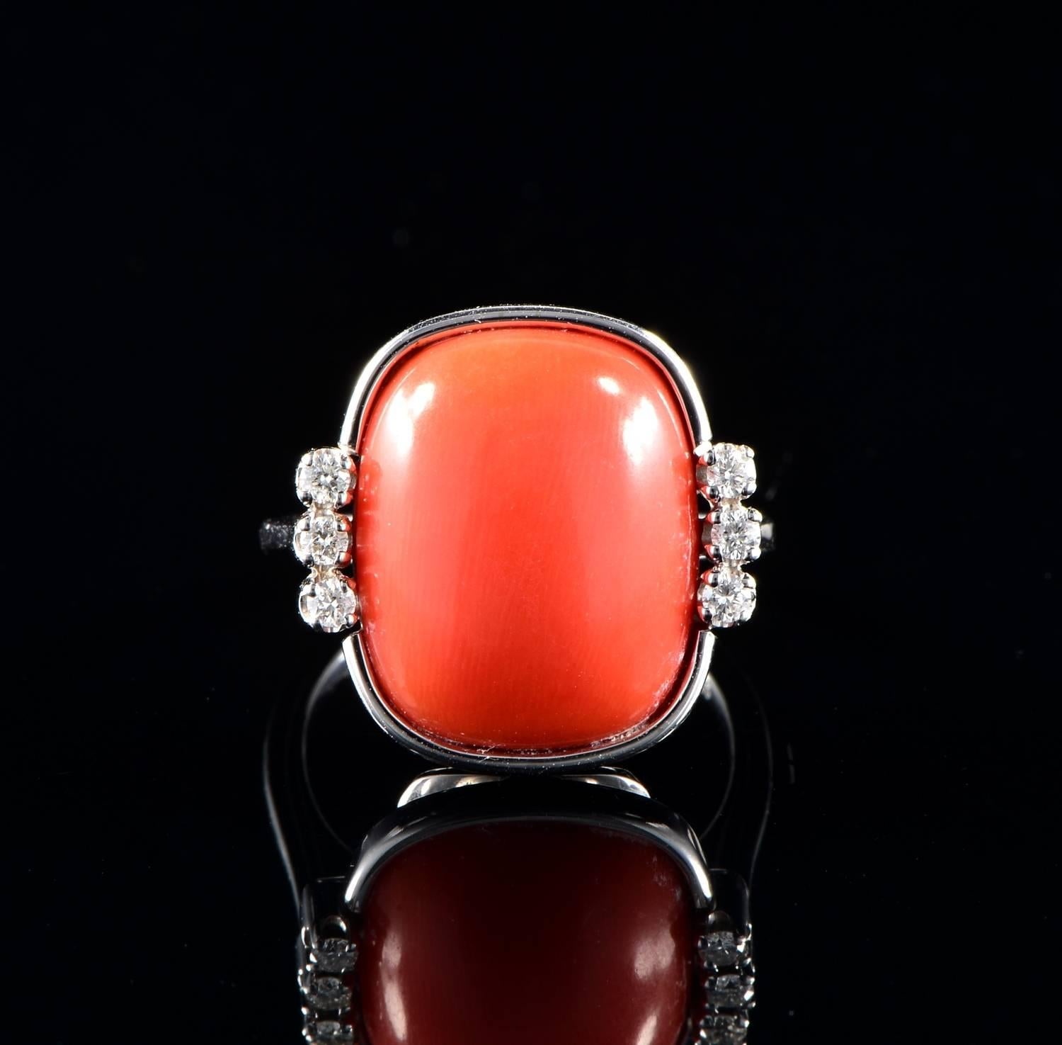 Italian origin

Individually hand crafted of solid 18 Kt white gold

The ring is of charming simple design made to exalt the beauty of the Natural Large Cabochon of Coral of very pleasing red tomato colour not treated or tinted, measures 17 mm. x 15