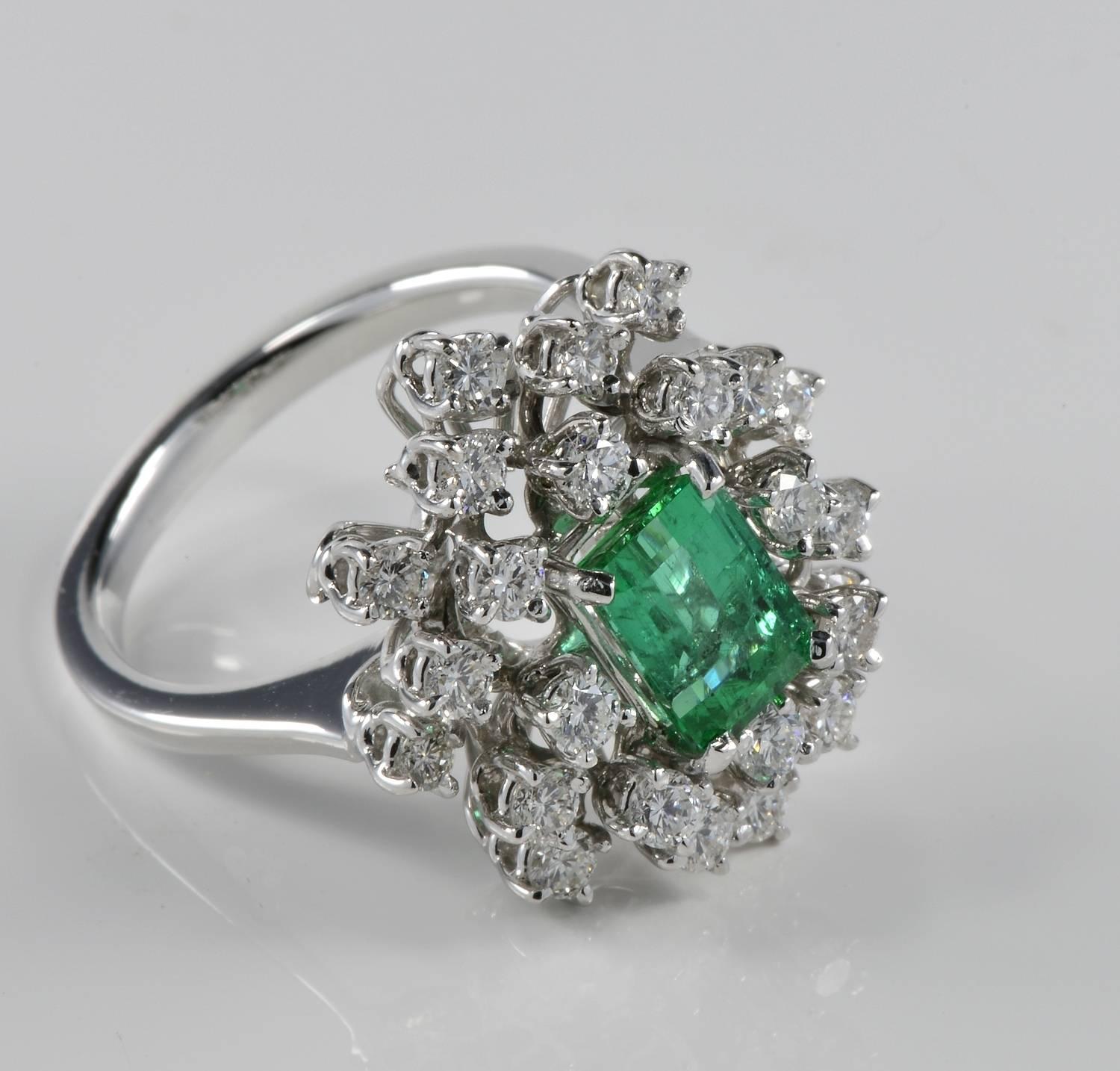 Superior in quality classy vintage cluster ring set with top quality Natural Emerald 1.70 Ct (7.78 mm. x 5.49 mm.) Colombian origin prizing a fine degree for colour and clarity.
The rich Diamond surround totalling 1.50 Ct rated G VVS/VS